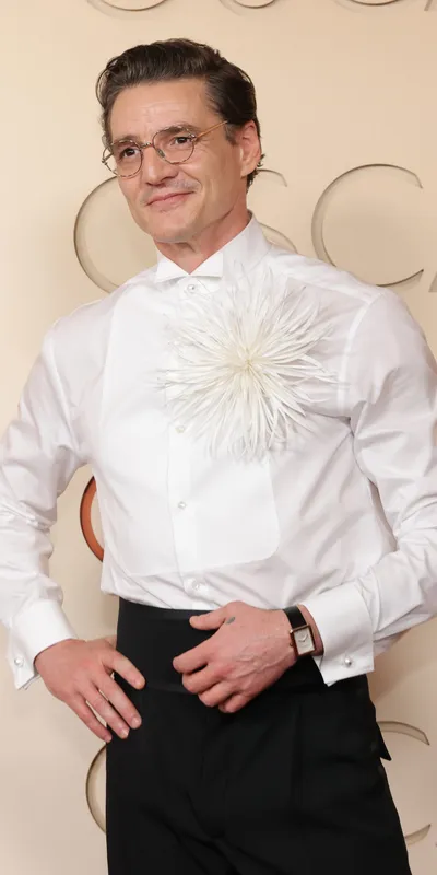 <p>Pedro Pascal wears Chanel Boy.Friend watch in beige gold</p>