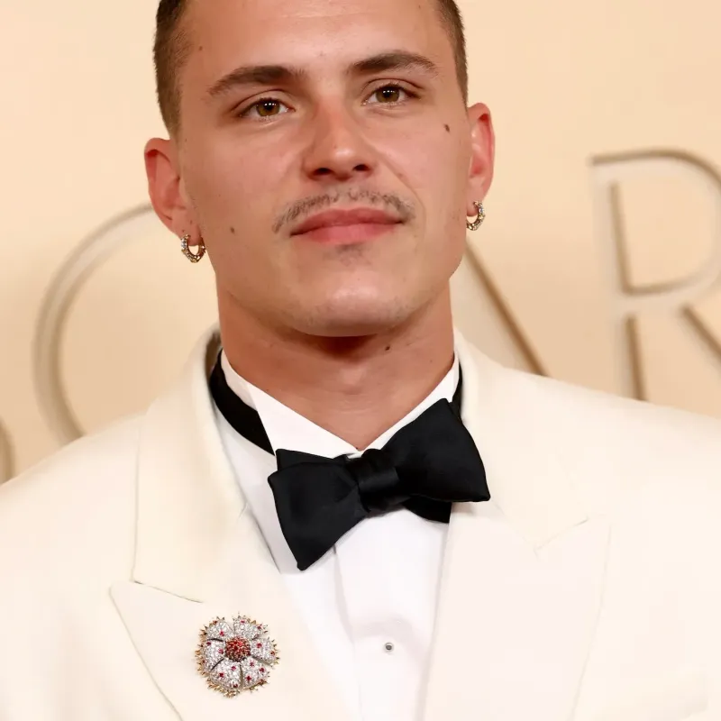 <p>Arón Piper wears Tiffany & Co. Jean Schlumberger by Tiffany & Co. Zinnia brooch in yellow gold and platinum, set with diamonds and rubies, Sixteen Stone by Tiffany & Co. narrow earrings in platinum and yellow gold, set with diamonds, Sixteen Stone by Tiffany & Co. bracelet in platinum and yellow gold, set with diamonds, Sixteen Stone by Tiffany & Co. ring in yellow gold and platinum, set with diamonds, and Sixteen Stone by Tiffany & Co. ring in platinum, set with diamonds</p>