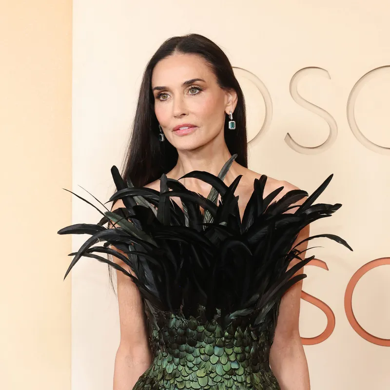 <p>Demi Moore wears the Vendôme Liseré sleepers in white gold, set with blue emerald-cut tourmalines, diamonds and black lacquer, Vendôme Liseré ring in white gold, set with a 4.13ct emerald-cut diamond, round diamonds and black lacquer, Vendôme Liseré bracelet in white gold, set with round diamonds, emerald-cut diamonds and black lacquer and Ruban Diamants transformable piece in a bracelet version from Histoire de Style, Art Déco high jewellery collection in white gold, set with diamonds</p>