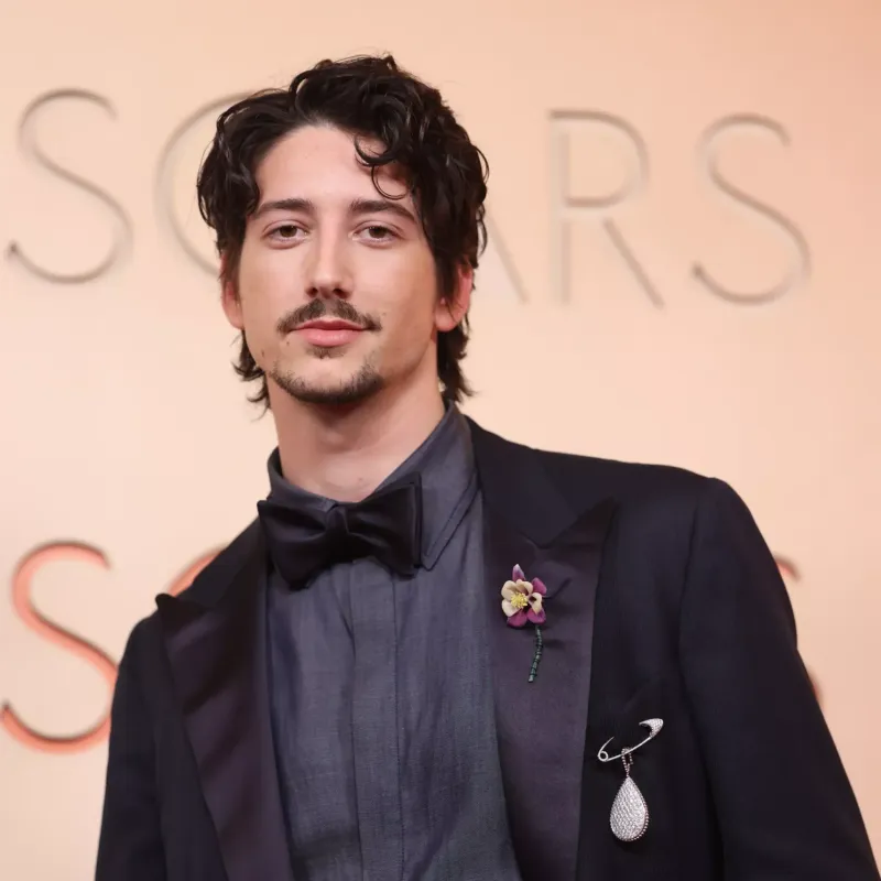 <p>Milo Manheim wears Boucheron Serpent Bohème XXL motif brooch from the transformable medallion in white gold, set with diamonds, Quatre Radiant Edition wedding band in white gold and Quatre Black Edition bracelet in white gold, set with diamonds and black PVD</p>