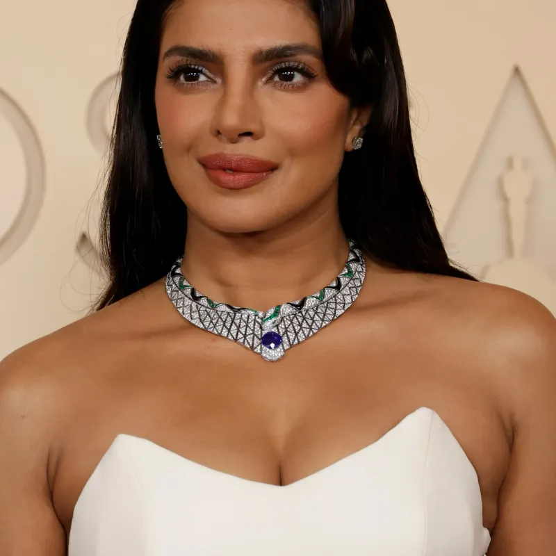 <p>Priyanka Chopra wears Bulgari Serpenti high jewellery necklace in white gold, set with onyx elements, 1 cushion sapphire, 1 round diamond, 2 buff-top sapphires, 130 buff-top emeralds and pavé-set diamonds, high jewellery ring in platinum, set with 1 emerald shape diamond, 14 fancy diamonds and pavé-set diamonds and high jewellery earrings in platinum, set with 2 cushion diamonds</p>
<p> </p>