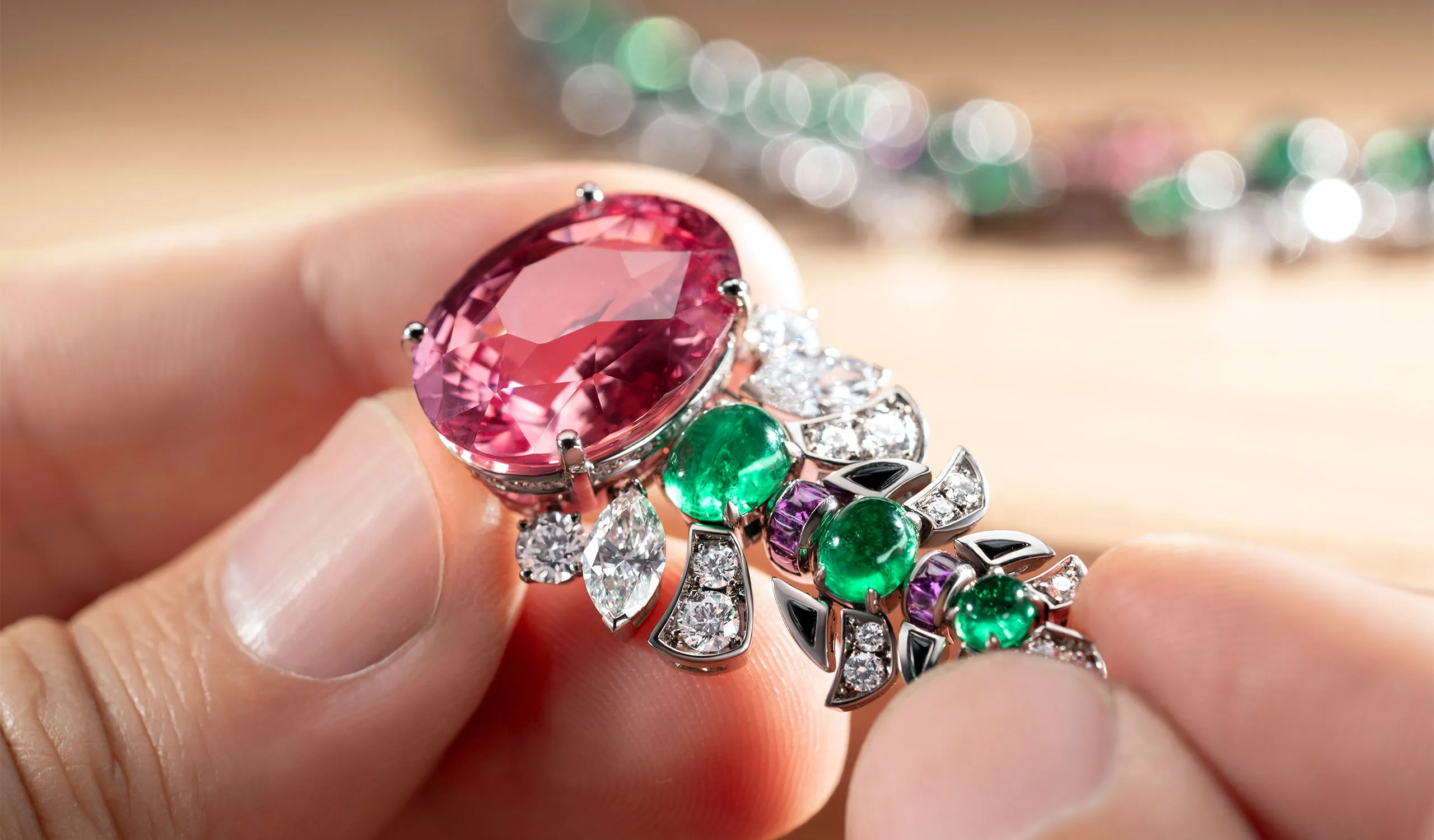 <p>Setting the 26.65ct oval Padparadscha sapphire in the Eclettica Secret Garden high jewellery necklace</p>