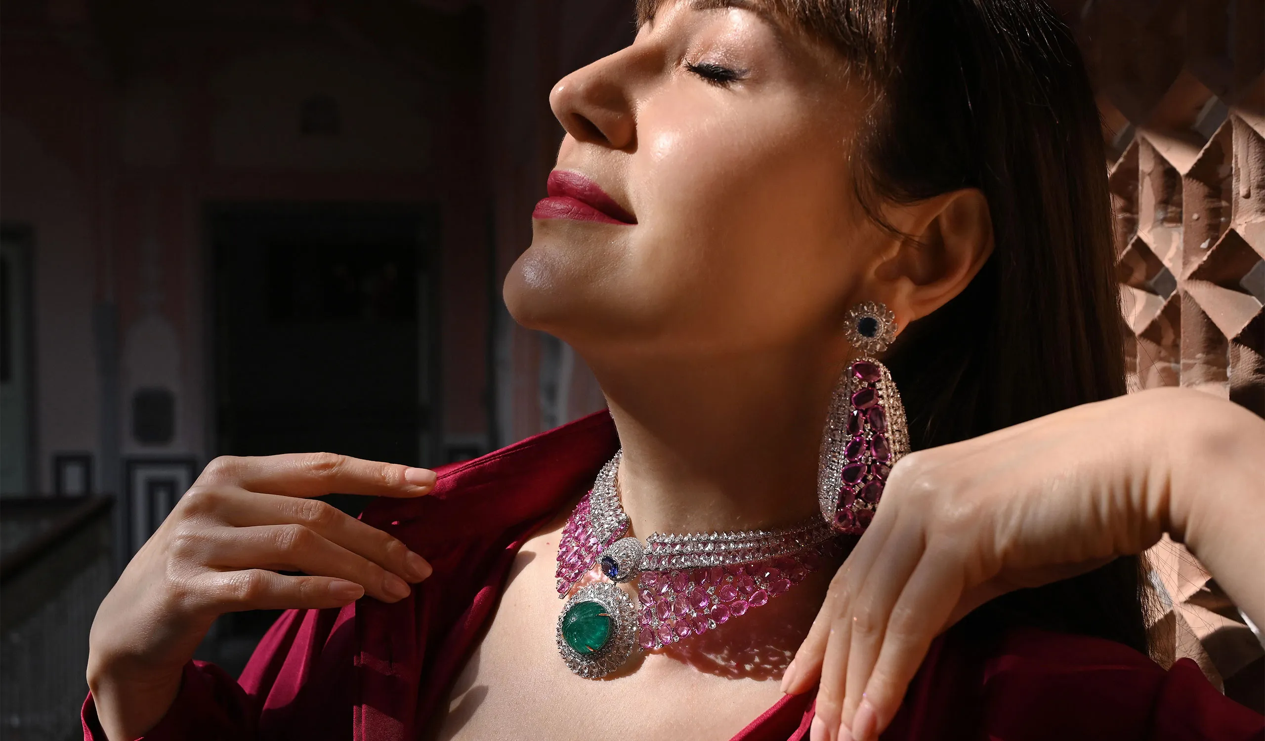 <p>Katerina Perez wears unique creations from the Diviano One Collection, including a necklace with 37 carats of carved Colombian emerald, Ceylon sapphires, pink sapphires and 65 carats of rose-cut diamonds </p>
