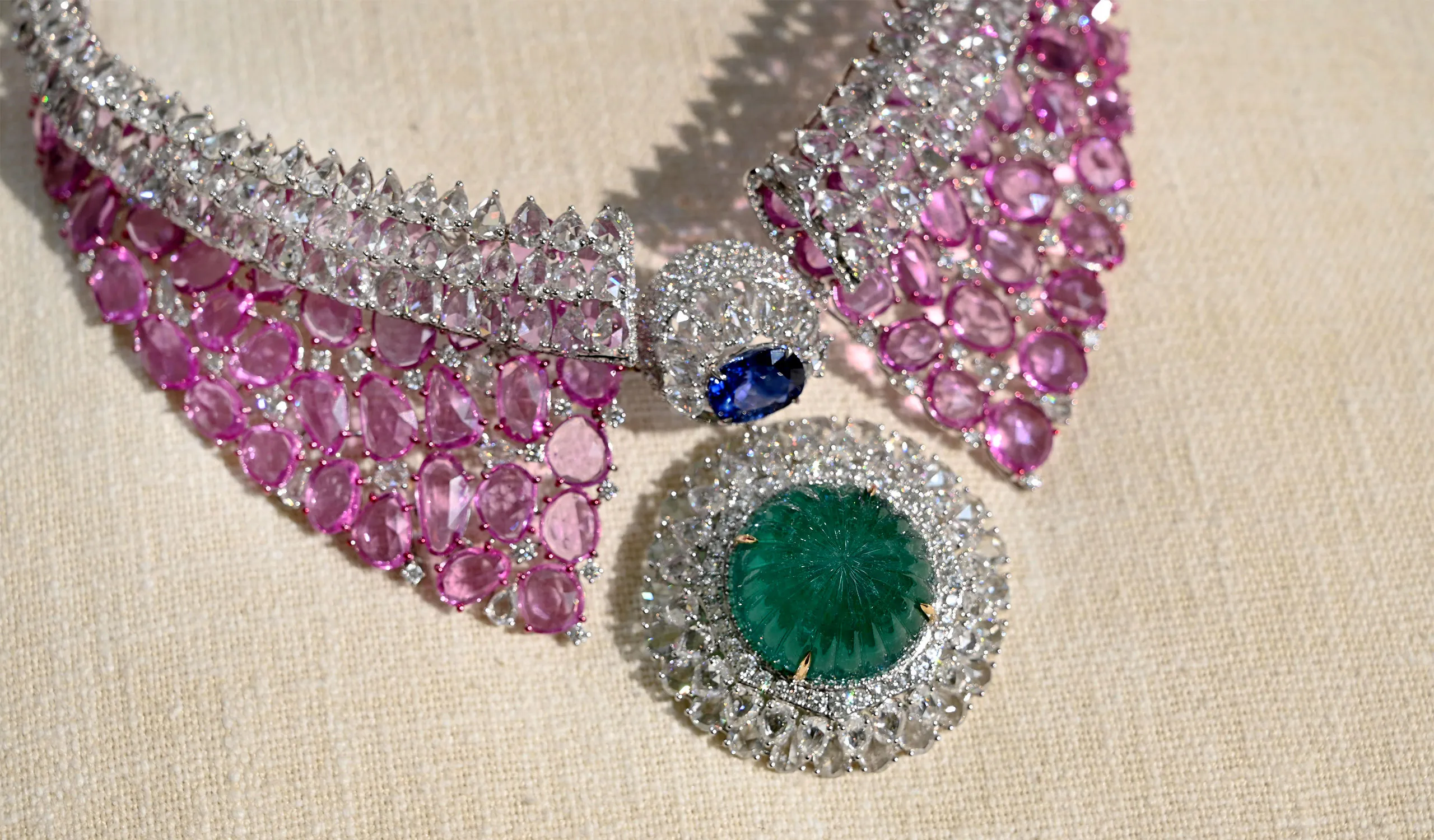 <p>A High Jewellery necklace from the Diviano One Collection, set with carved Colombian emerald, Ceylon blue sapphires, pink sapphires and rose-cut diamonds in 18k white gold </p>