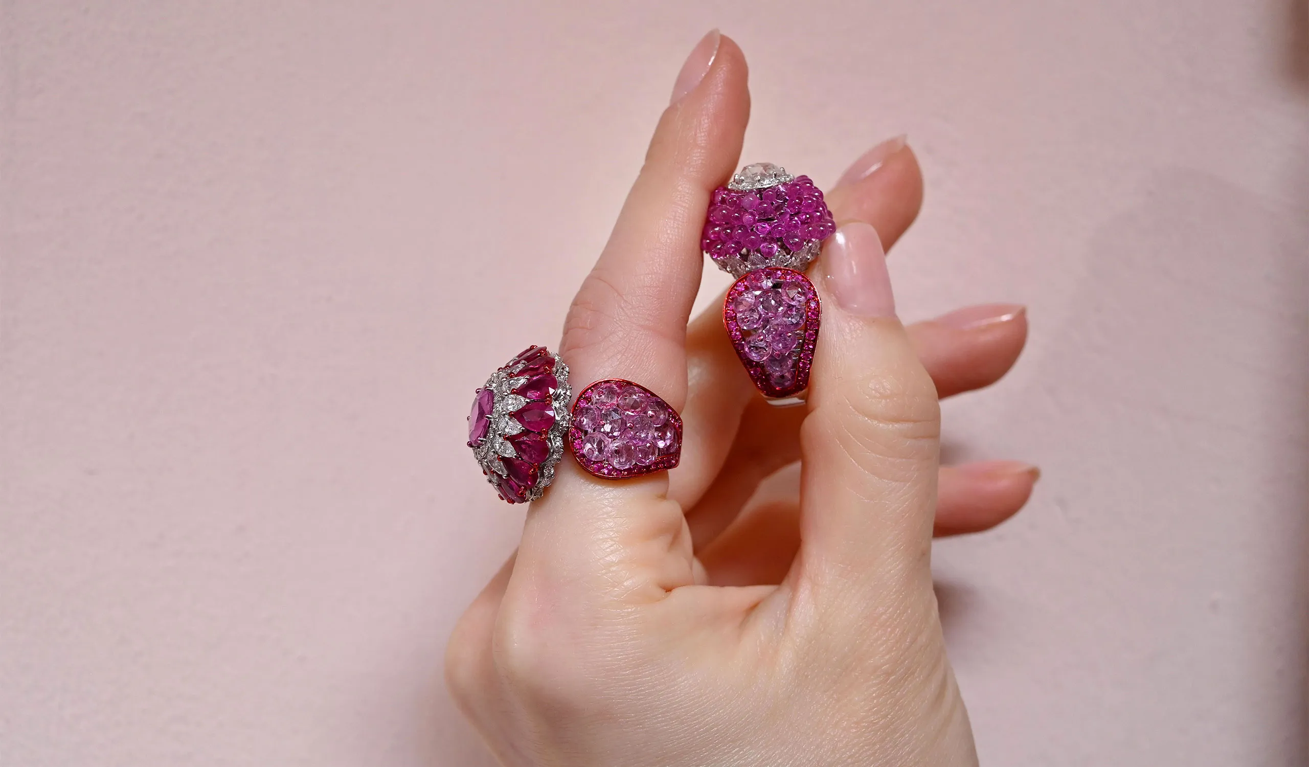 <p>With the Lamella technique, Diviano creates overlapping surfaces of rose-cut gemstones, as featured in this ring with ruby beads, pear-shaped diamonds, and pink sapphires </p>