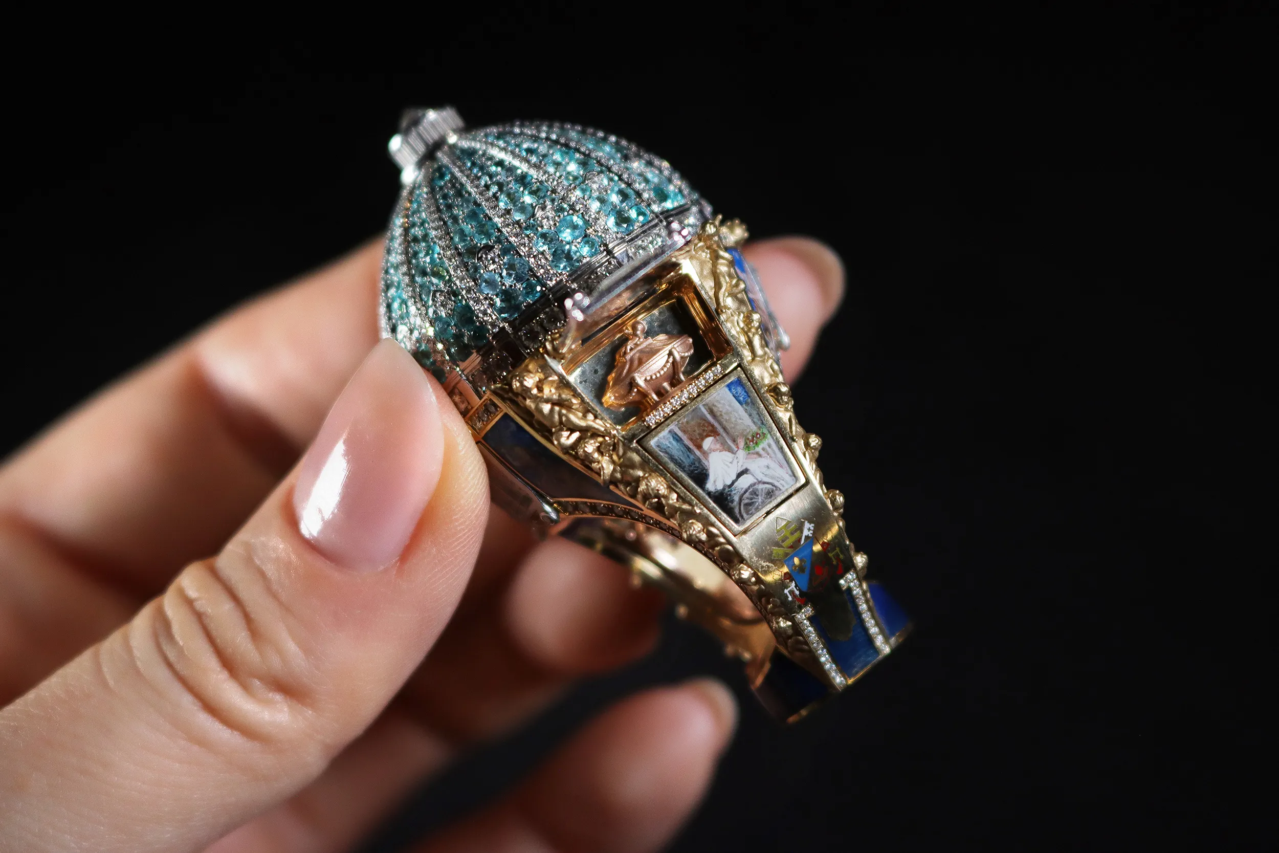 <p>One of the doors opens to reveal a miniature painting depicting the last goodbye of Pope Francis</p>