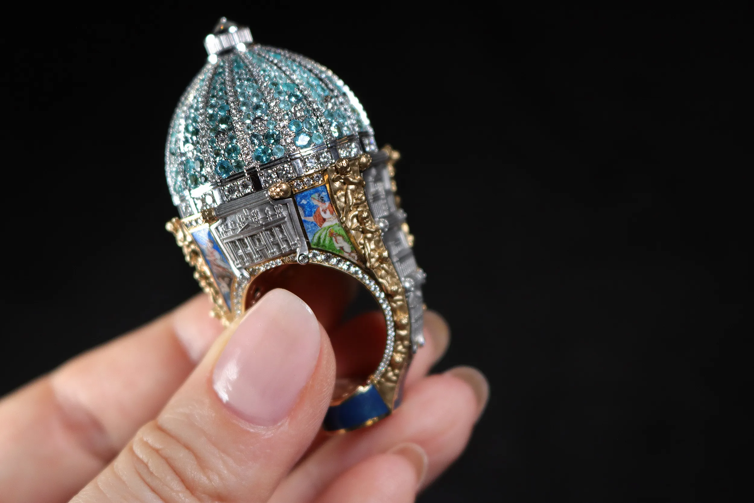 <p>The materials used to craft the Jubilee Ring include diamonds, tsavorites, Paraiba tourmalines, white quartz, Impactite Libyan glass, enamel and Egyptian blue and walnut ink pigments</p>