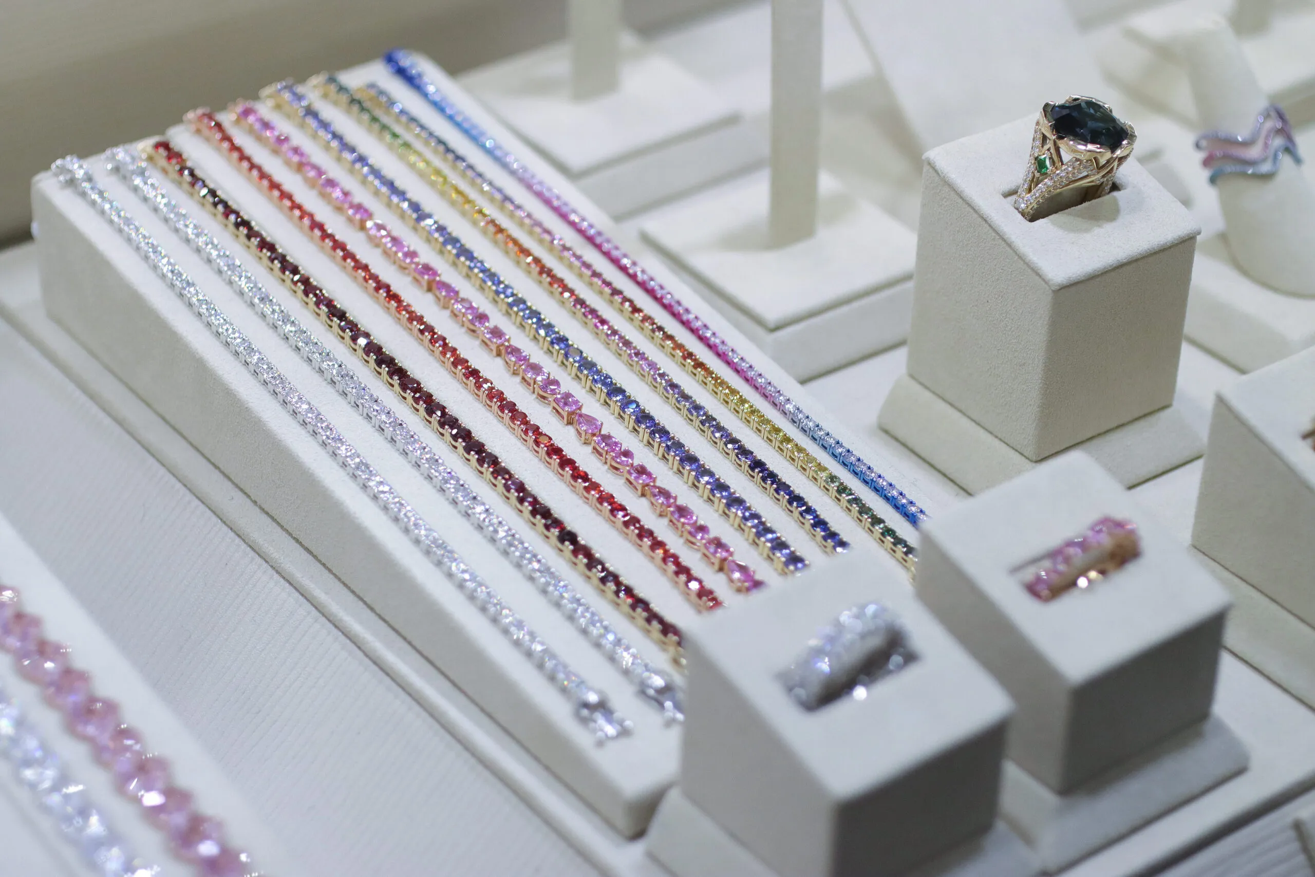 <p>Coloured gemstone tennis bracelets, eternity rings and cocktail rings available at Palm Beach Gems by Nicole</p>