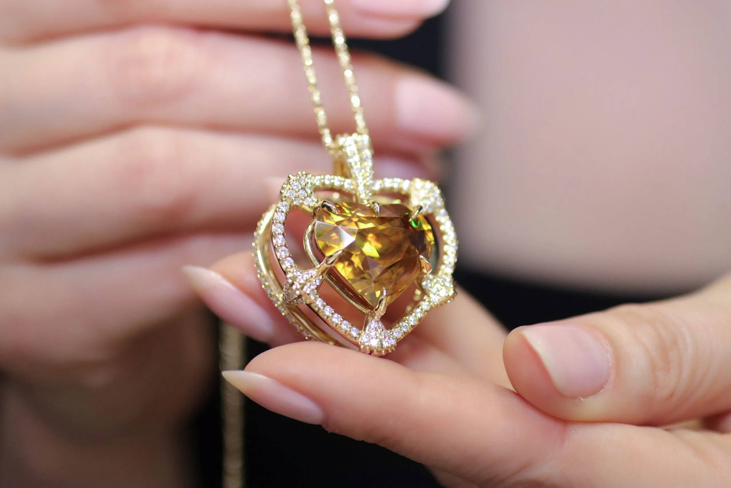 <p>Palm Beach Gems by Nicole pendant, designed by Robin Callahan, set with a 26 carat heart-shaped sphene surrounded by diamonds in 18k gold</p>