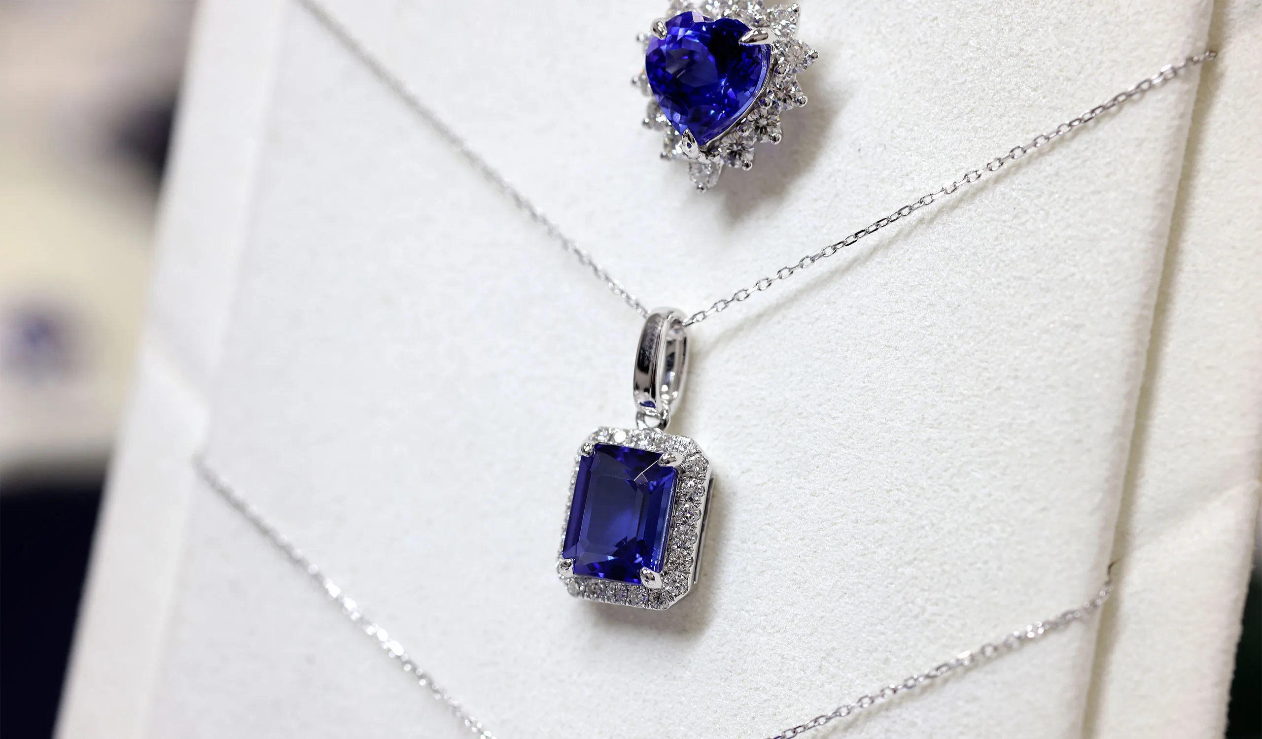<p>An emerald-cut tanzanite pendant with white diamonds, crafted by the Royal Touch Group</p>