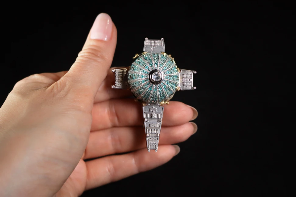 <p>The radiant dome is set with Paraiba tourmalines and diamonds</p>
