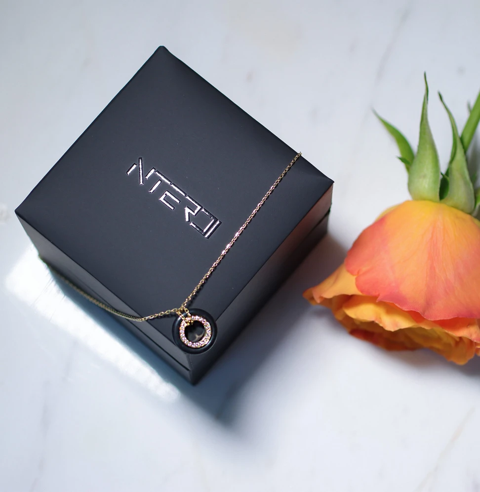 <p>NTERDI Rubber Me pendant in 18k yellow gold, rubber and diamonds</p>