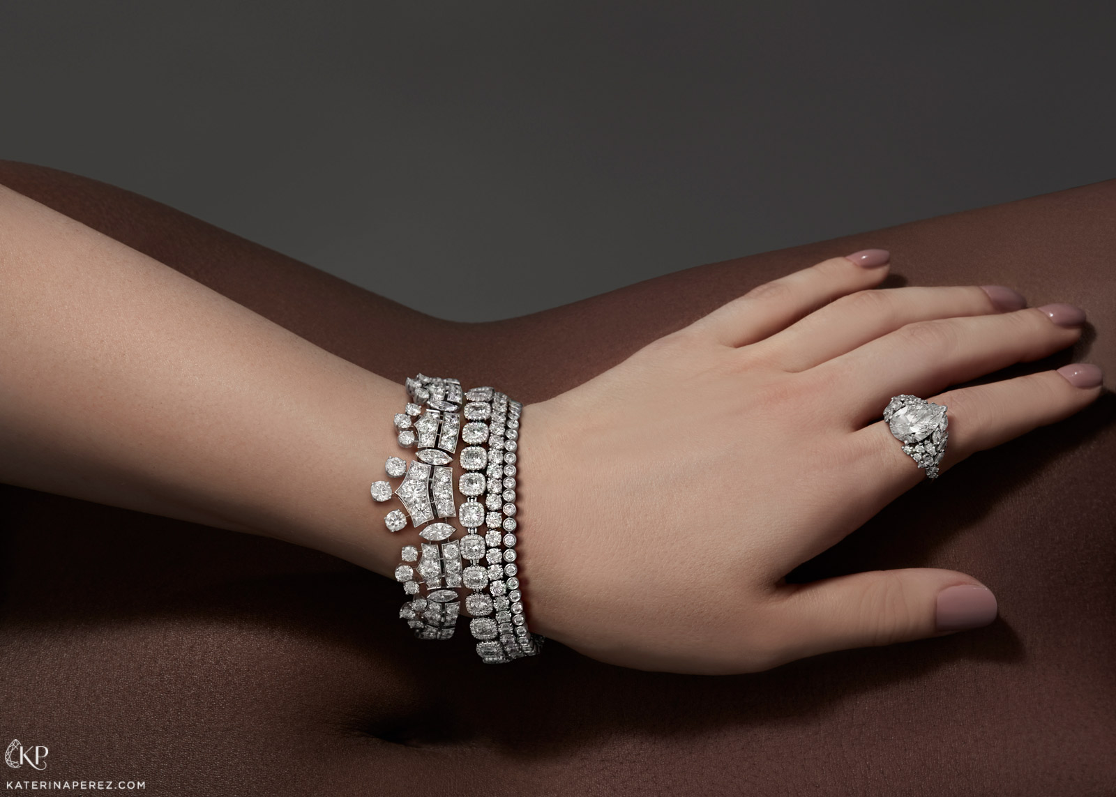 From left to right: De Beers 'Phenomena', 'Aura' and 'Classic Lines' bracelets with diamonds and 'London' ring from the 'Thames Path' collection with pear cut feature diamond and accenting diamonds
