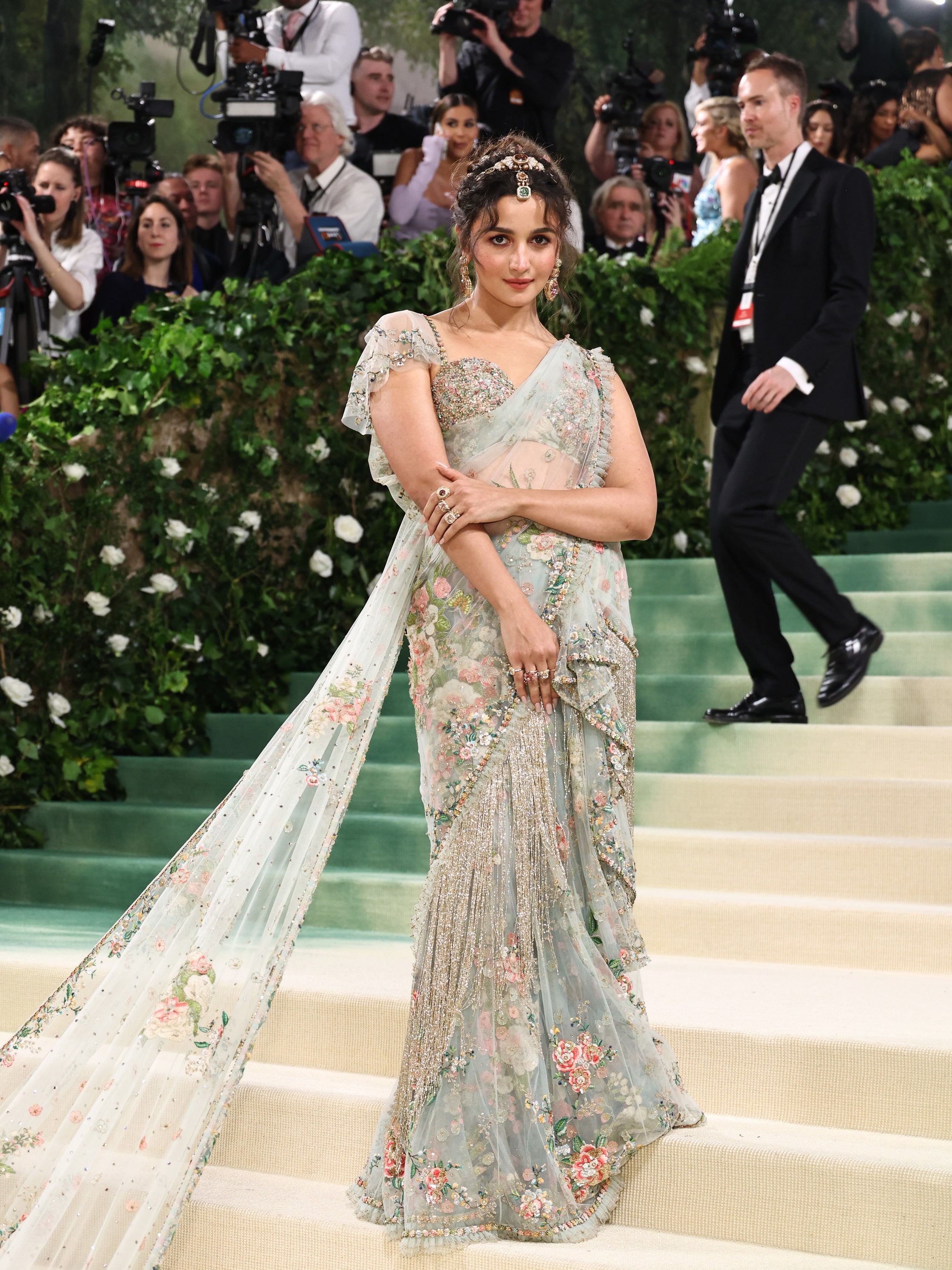 British-Indian actress Alia Bhatt wearing Sabyasachi to the Met Gala 2024, including a blouse studded with emeralds, Basra pearls, tourmalines and sapphires 