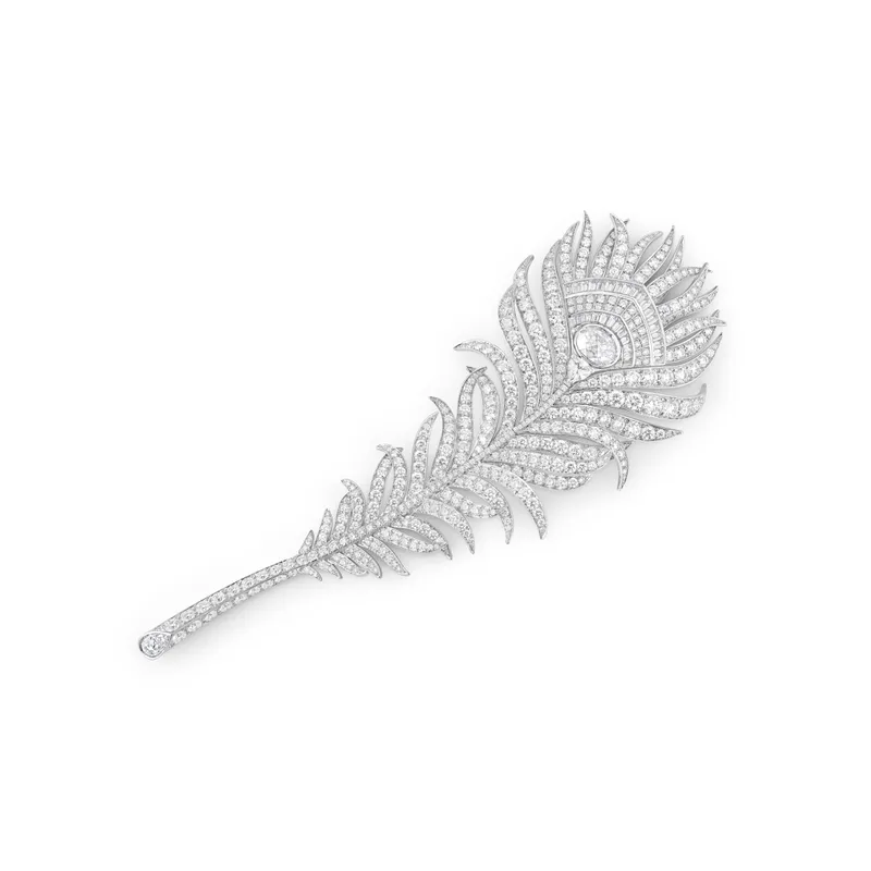 <p>The Boucheron Plume de Paon XL brooch worn by Tramell Tillman</p>