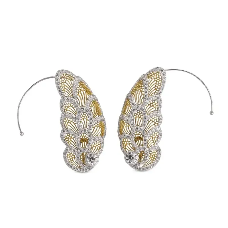 <p>Art collection earrings in yellow and white gold with diamonds</p>