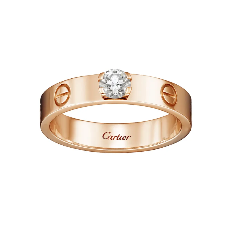 <p>‘Love’ diamond and yellow gold solitaire engagement ring</p>
