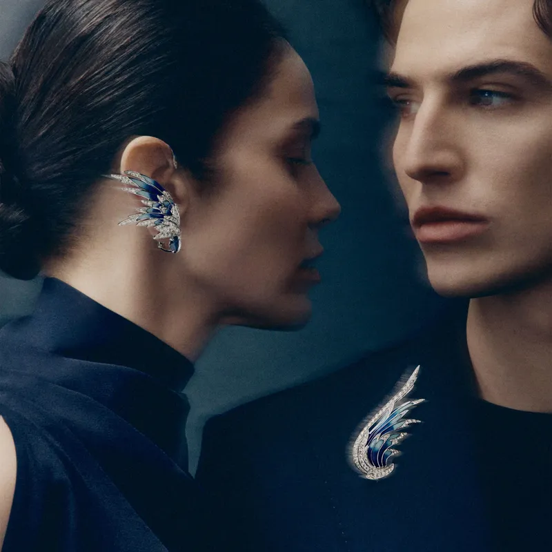 <p>The Envol grand feu enamel and diamond ear cuff, which transforms into an earring, and one of two Envol high jewellery brooches</p>