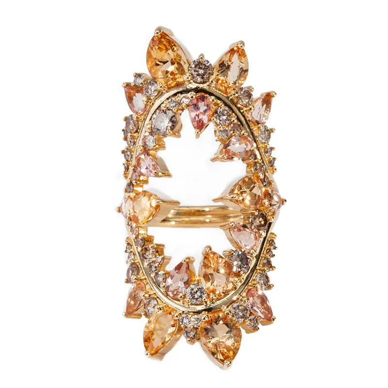 <p>Electric Shock ring in yellow gold with white and brown diamonds and Imperial topaz</p>