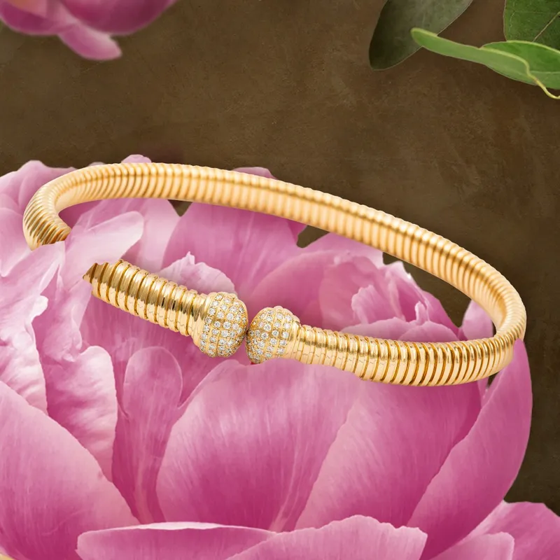 <p>Tourbillon collection bracelet with diamonds set in 18k yellow gold</p>
