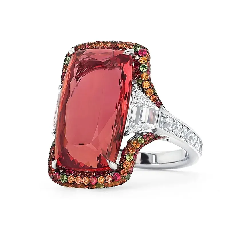 <p>18 cts Imperial topaz ring, with two step-cut trapezoid diamonds and micro-set with diamonds, sapphires, tsavorite garnets and tourmalines</p>