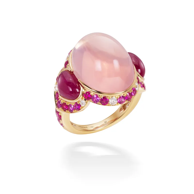 <p>Marina B Pacila high jewellery ring, set with a 16.54ct oval rose quartz cabochon, pear-shaped rubies and pavé-set pink sapphires, rubies and diamonds in 18k yellow gold</p>