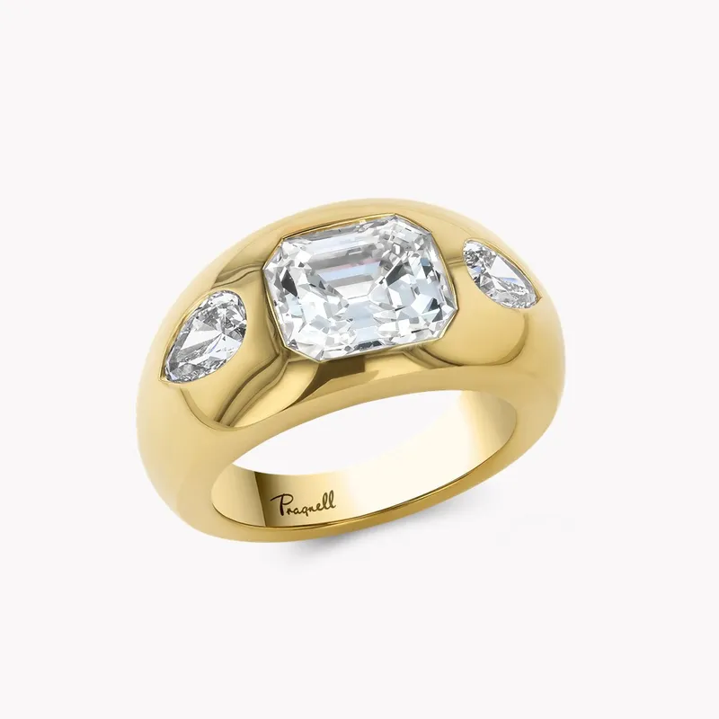 <p>Pragnell 2.02 carat emerald cut diamond bombé ring in 18K yellow gold with pear shape diamonds.</p>
