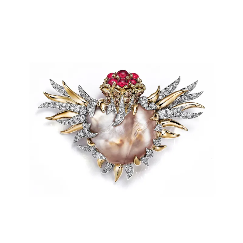 <p>Tiffany & Co. Bird on a Pearl high jewellery brooch set with a light orangy brown and white baroque natural saltwater pearl of 36.79 carats, Fancy Brown diamonds, cabochon rubellites and white diamonds</p>