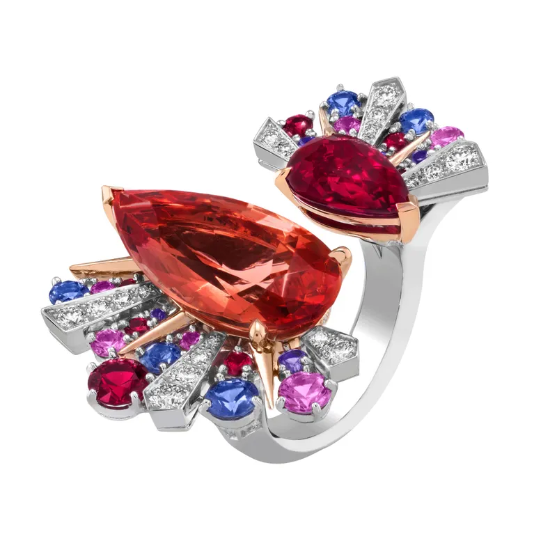 <p>Sous Les Etoiles Lever du jour Between the Finger ring in white gold, rose gold, one pear-shaped ruby of 3.02-cts, one pear-shaped imperial topaz of 10.43-cts, rubies, mauve and pink sapphires, and diamonds</p>