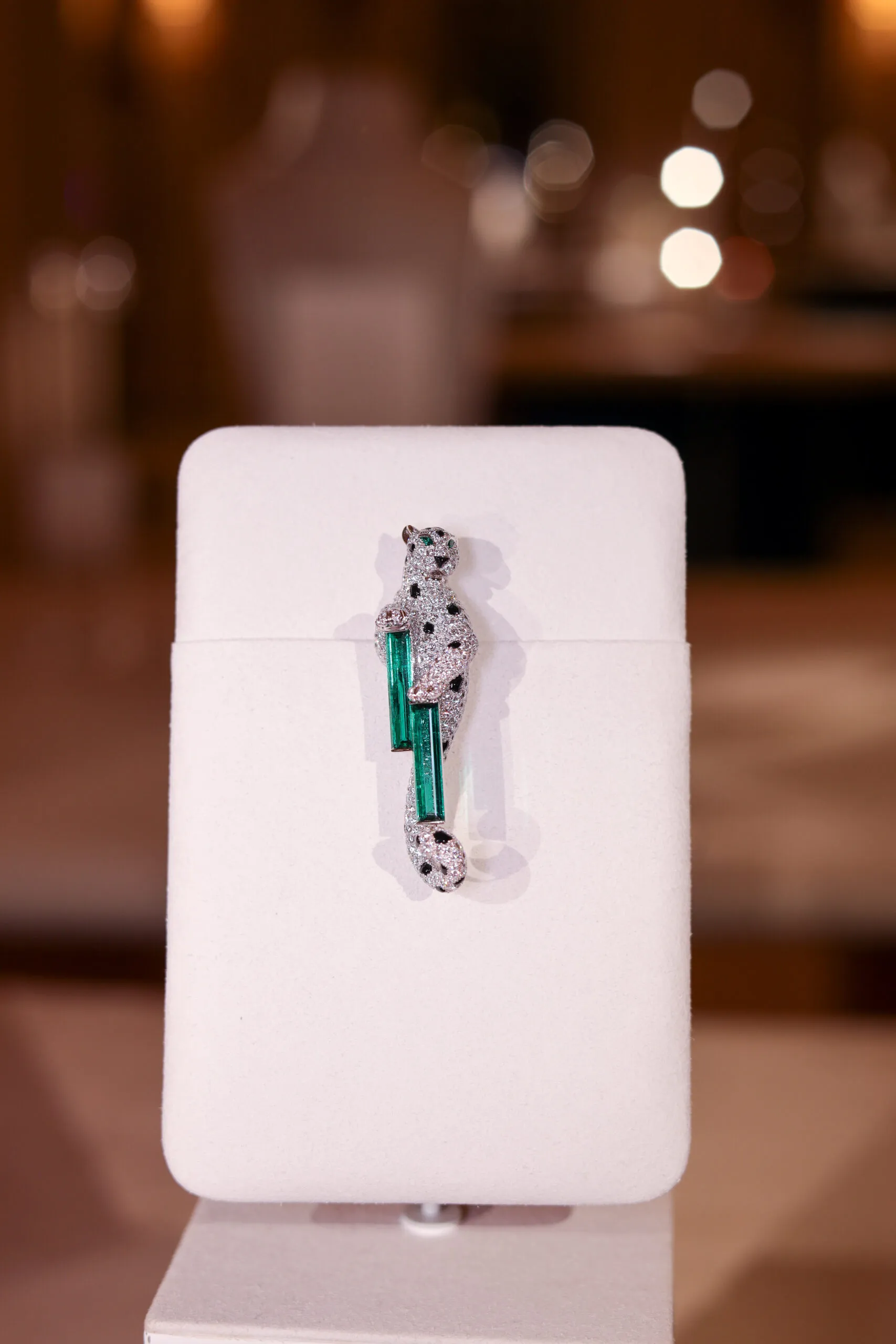 Cartier Nature Sauvage High Jewellery Panthère brooch in 18k white gold with emeralds, onyx and diamonds
