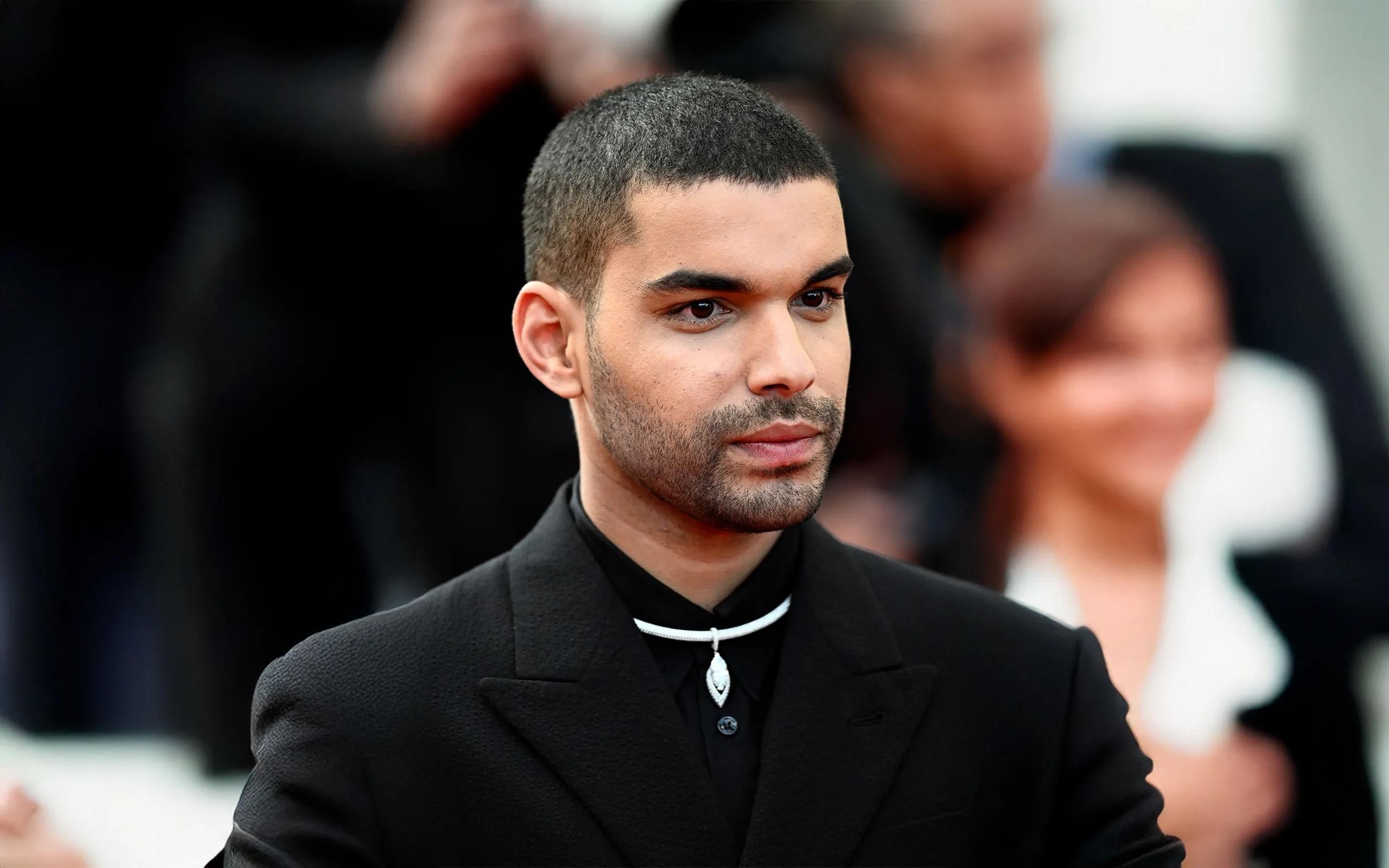 French actor Sami Outalbali wears the Messika Divine Enigma Marquise High Jewelry necklace to the Cannes Film Festival 2025
