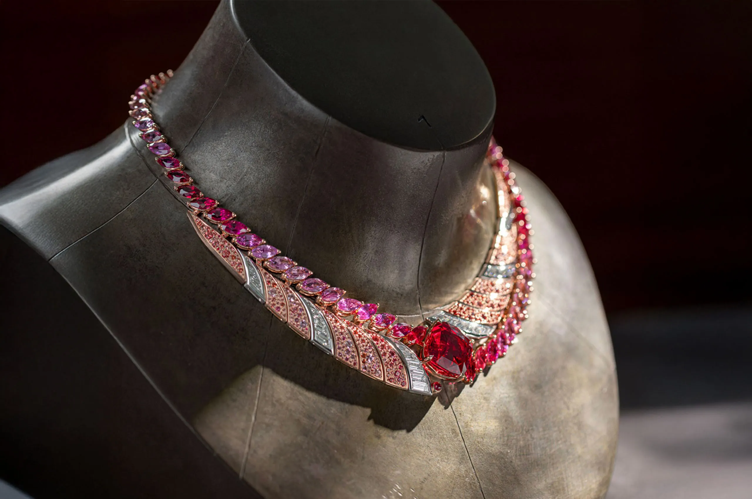 House of Gübelin Tanzanian Sunrise High Jewellery necklace with a 22 carat cushion-shaped red spinel from Tanzania, baguette-cut diamonds, orange and rose-coloured spinel pavé, and marquise-cut spinels, sapphires and rubies set in 18k rose gold and platinum 