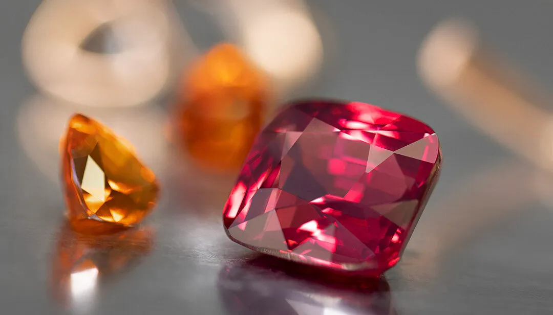 A Tanzanian purplish-red spinel of more than 9 carats alongside two mandarin garnets that feature in a new Classics cocktail ring from the House of Gübelin