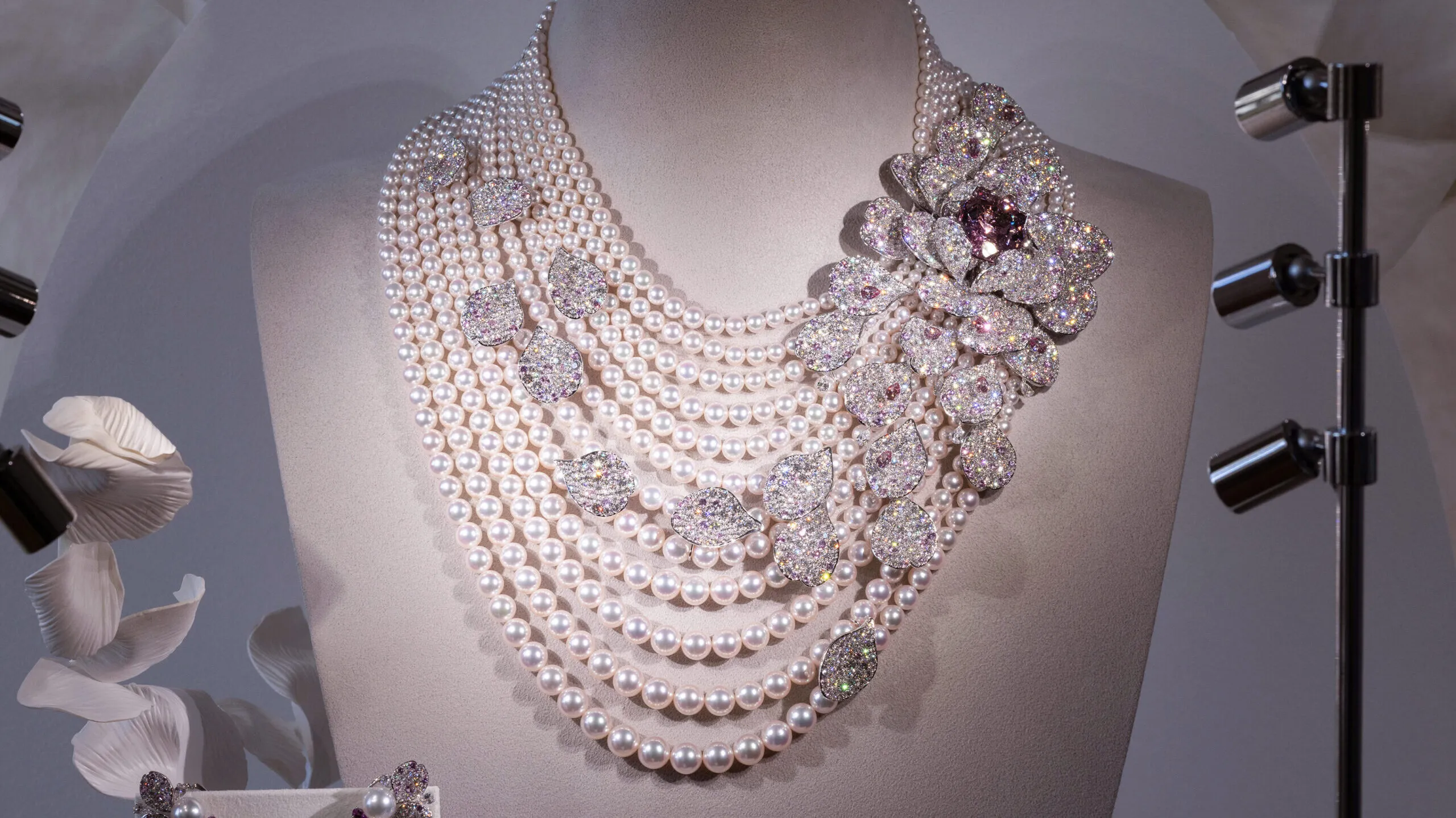 An Akoya cultured pearl necklace with a 31.29-carat morganite, 3.84 carats of garnet, 13.57 carats of sapphire and 71.96 carats of diamonds, set in 18k white gold, part of the Mikimoto Les Pétales High Jewellery collection
