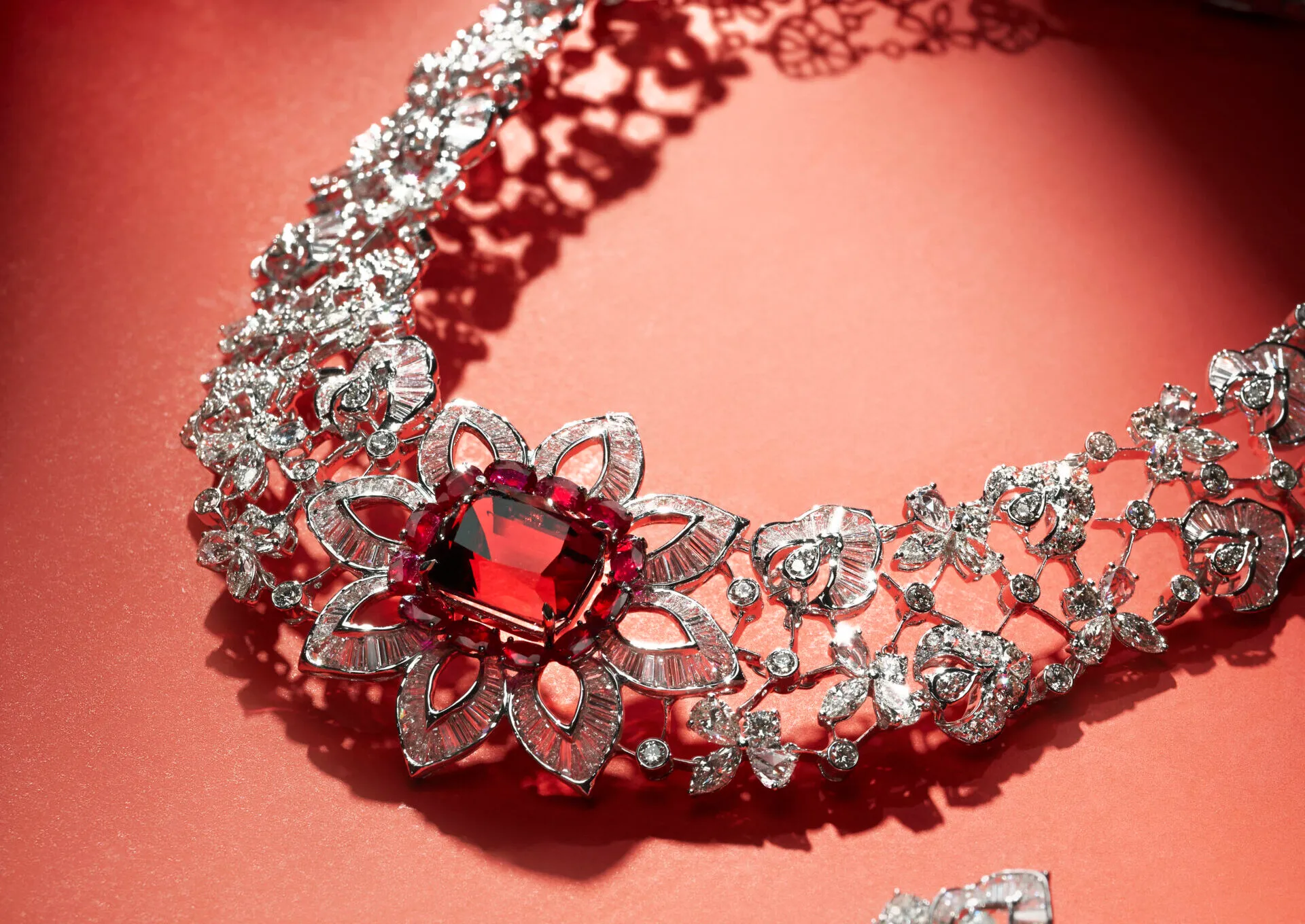 Jaipur Gems Sunset Serenade necklace with a 26-carat loupe clean Afghan tourmaline surrounded by rubies and diamonds in a floral motif   