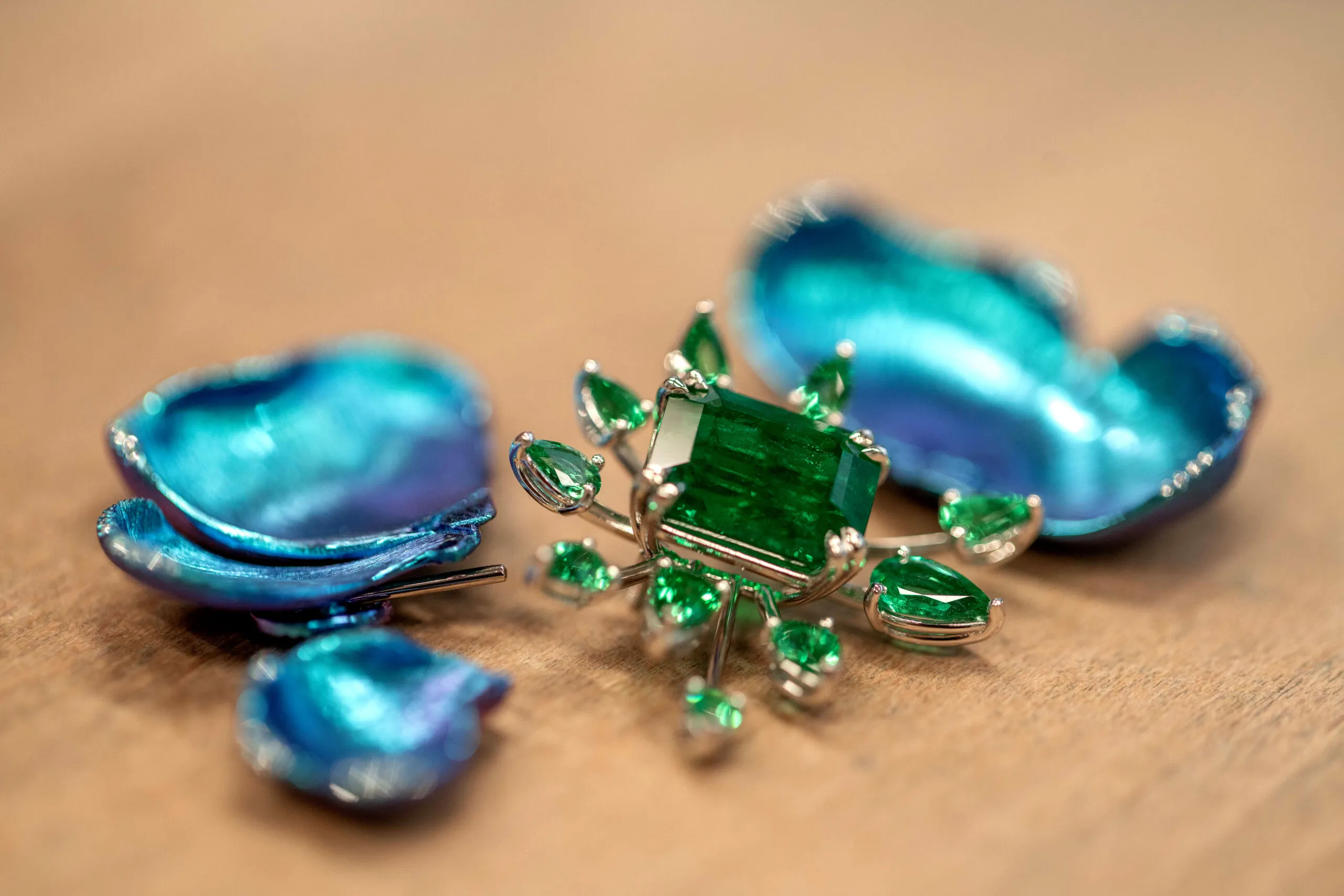 Floral earrings from Chopard’s Insofu collection in the making, crafted in 18-carat white gold, platinum and titanium, set with emeralds and brilliant-cut diamonds