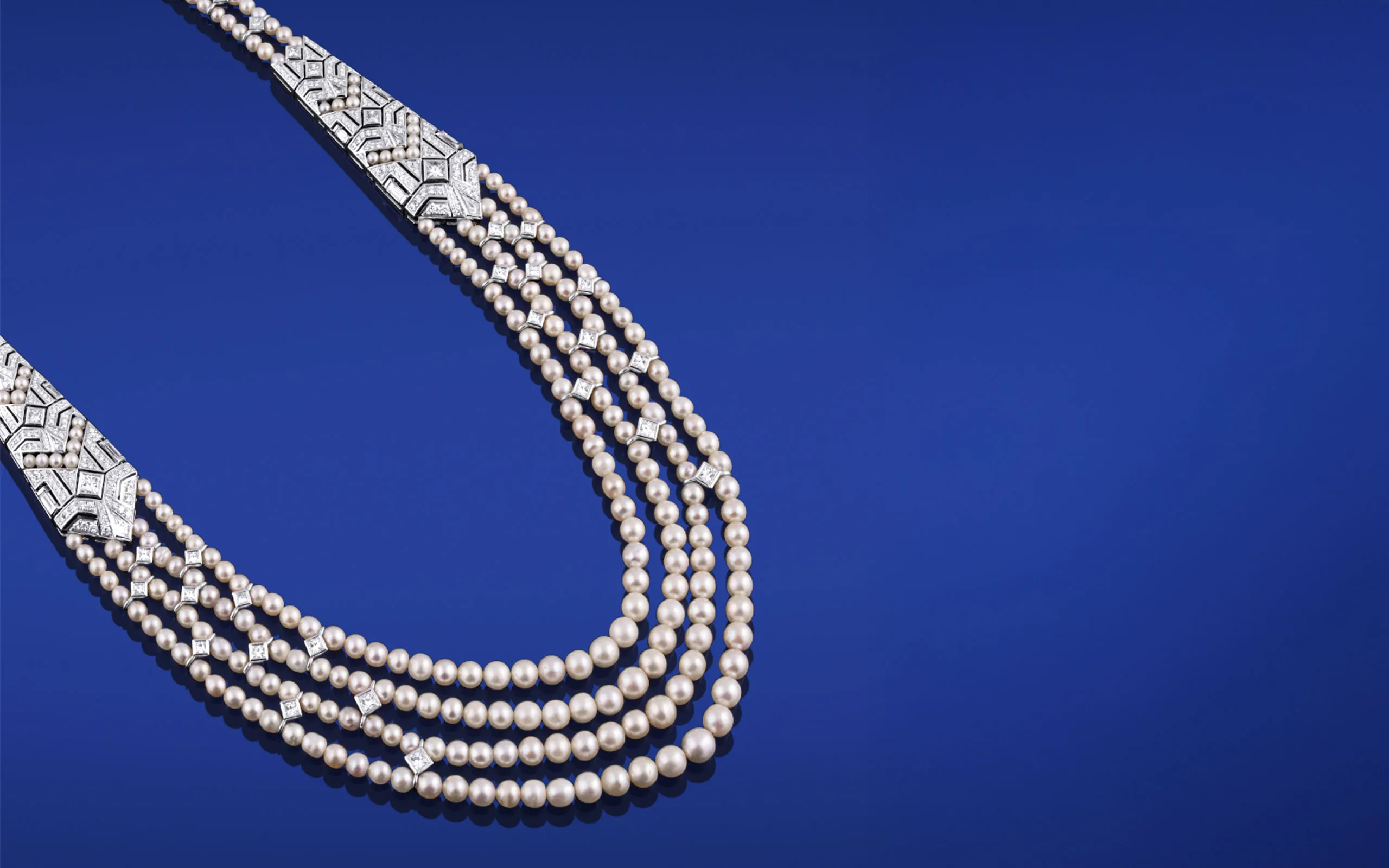 The diamonds of Arab Deco echo the angular elements found in Arabian architecture while the lustrous, rounded pearls echo the curves of the Art Deco movement