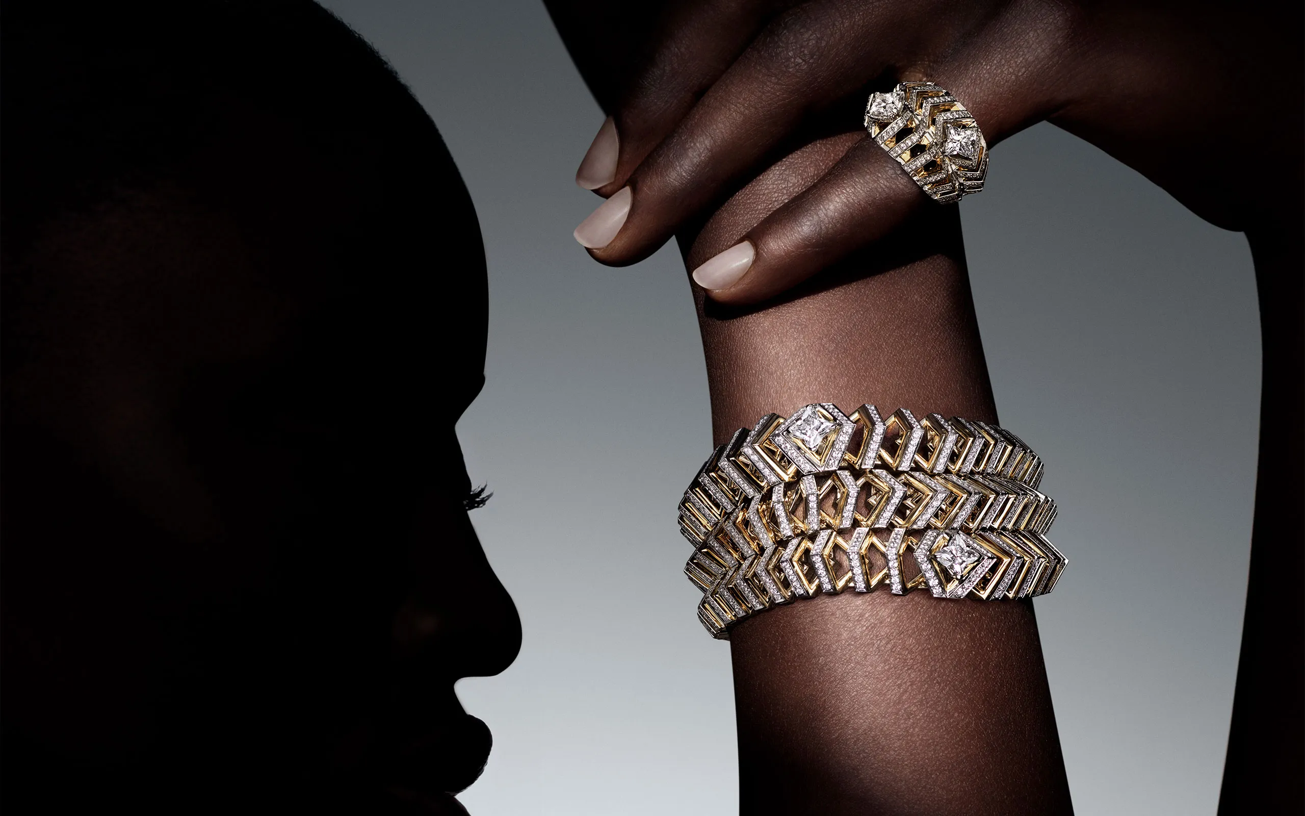 Louis Vuitton Dynamisme bracelet and ring in platinum and yellow gold with LV Monogram Star-cut diamonds from Chapter II of the Awakened Hands, Awakened Minds High Jewellery collection. ©Nathaniel Goldberg