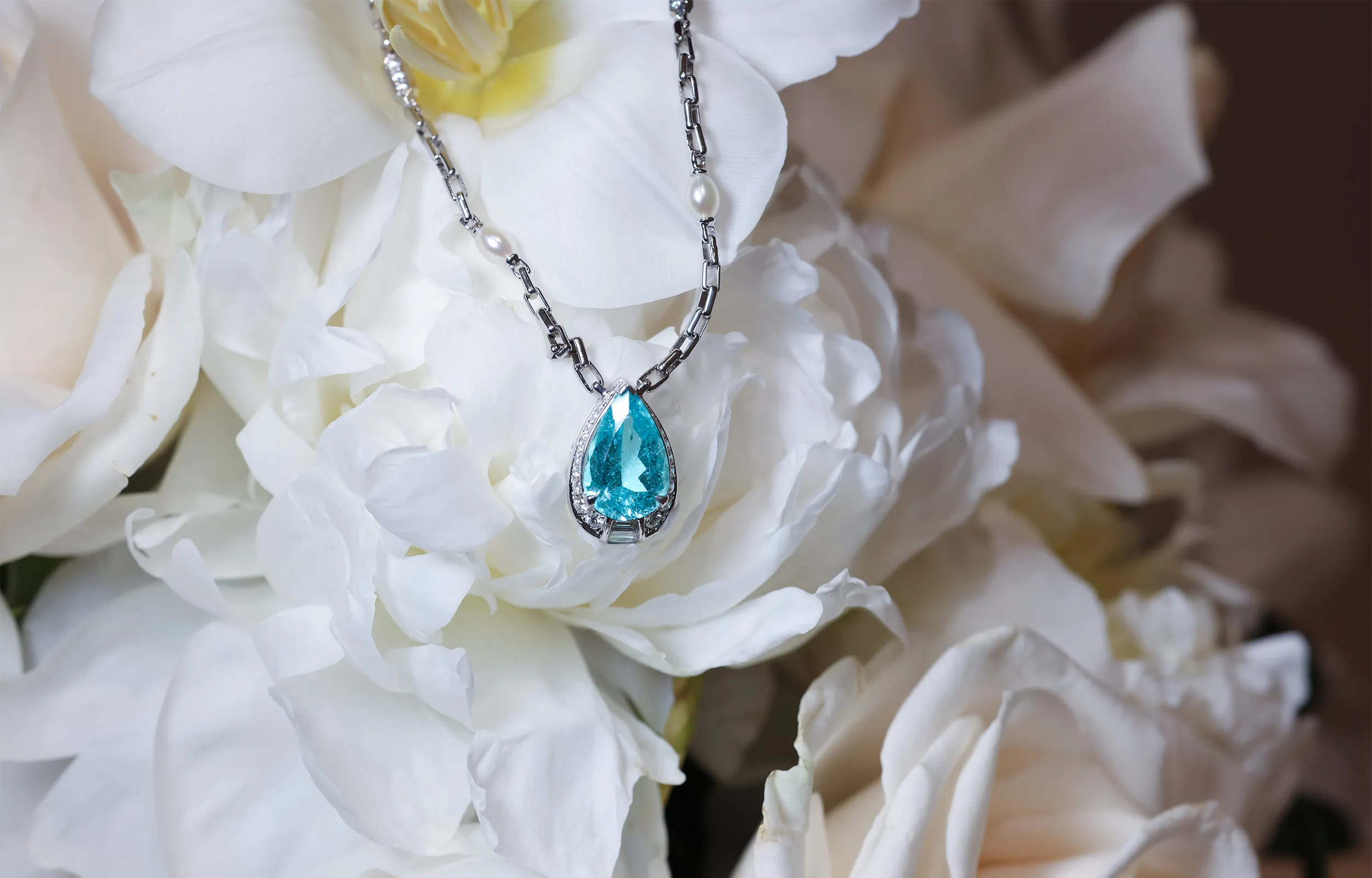 <p>A second high jewellery necklace from Al Zain’s Arab Deco collection, set with a 6.59ct carat pear shape Paraiba tourmaline, natural pearls and diamonds in 18k white gold</p>