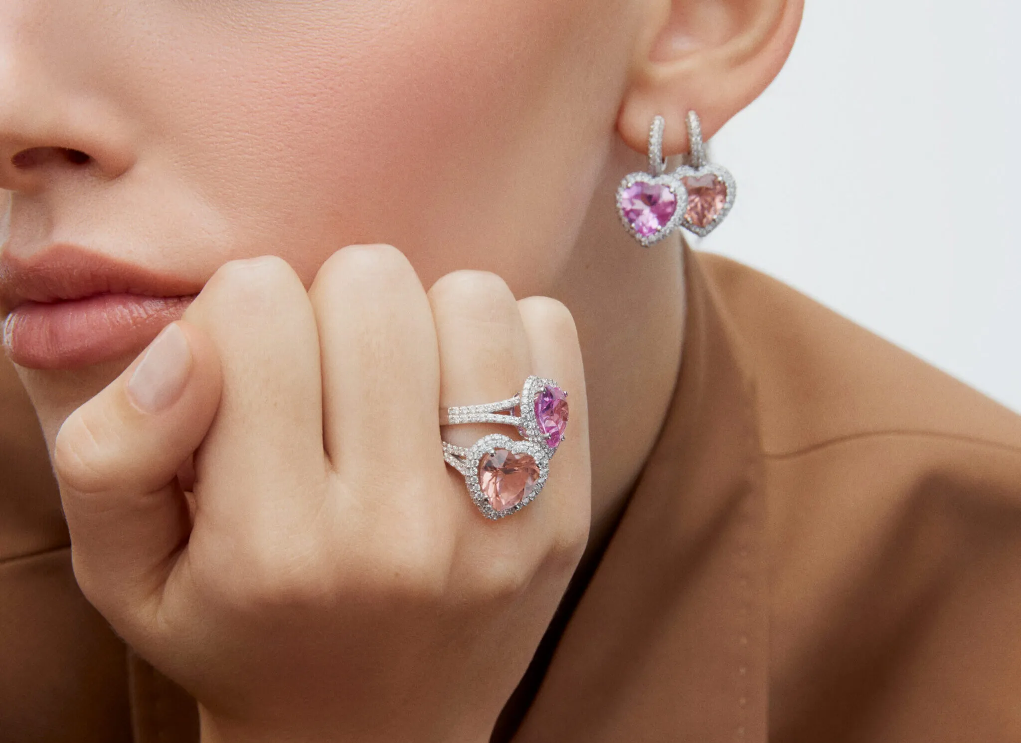 A model wears jewellery by Aponine, including the Heart Drop earrings with 8.46 carats of morganite and a matching 4.90 carat morganite ring, both from the Sassy Classics collection