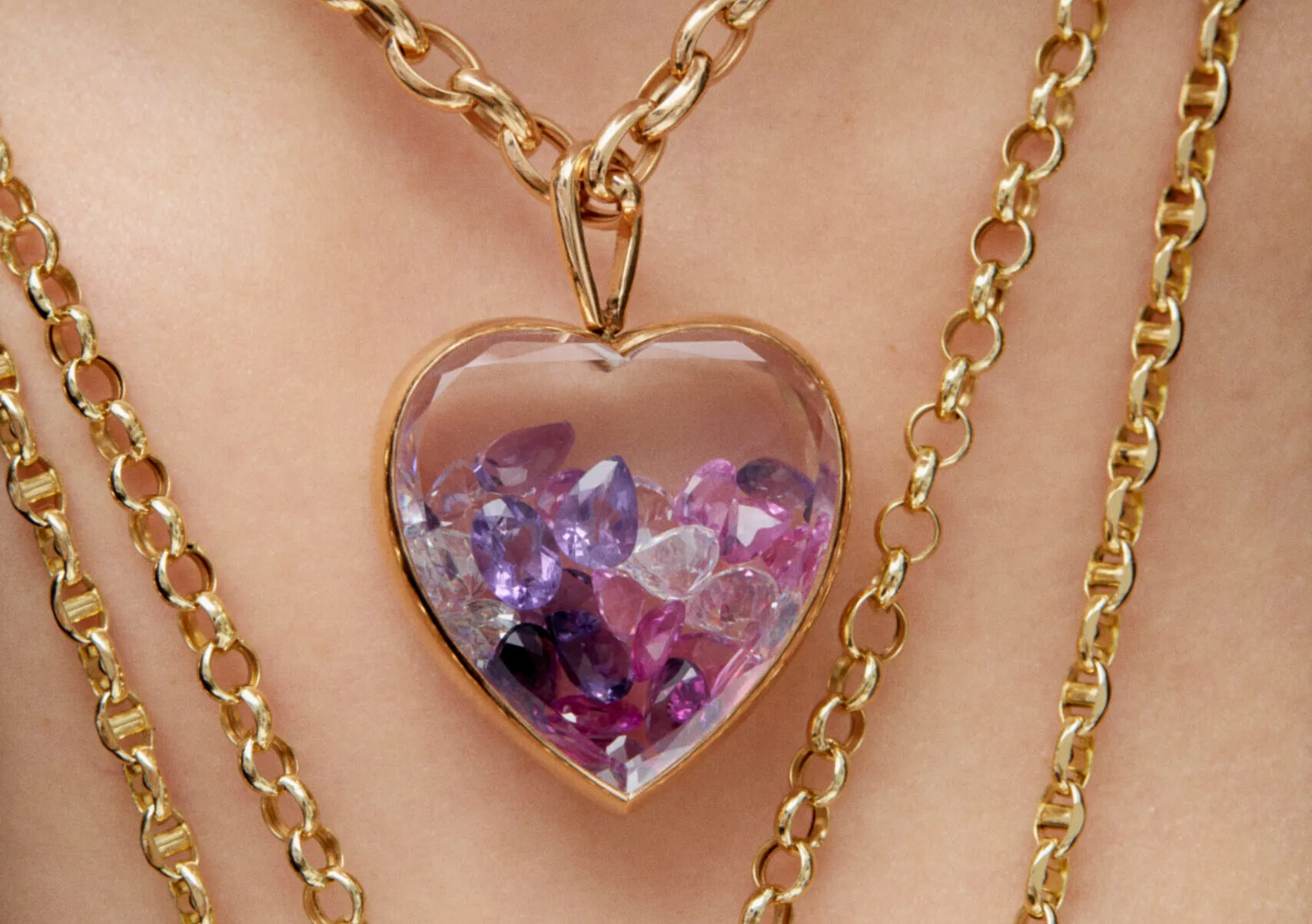 Aponine Heart Medallion from the Sparks collection crafted in white quartz and 18k yellow gold, filled with diamonds and purple crystals totalling 24.21 carats