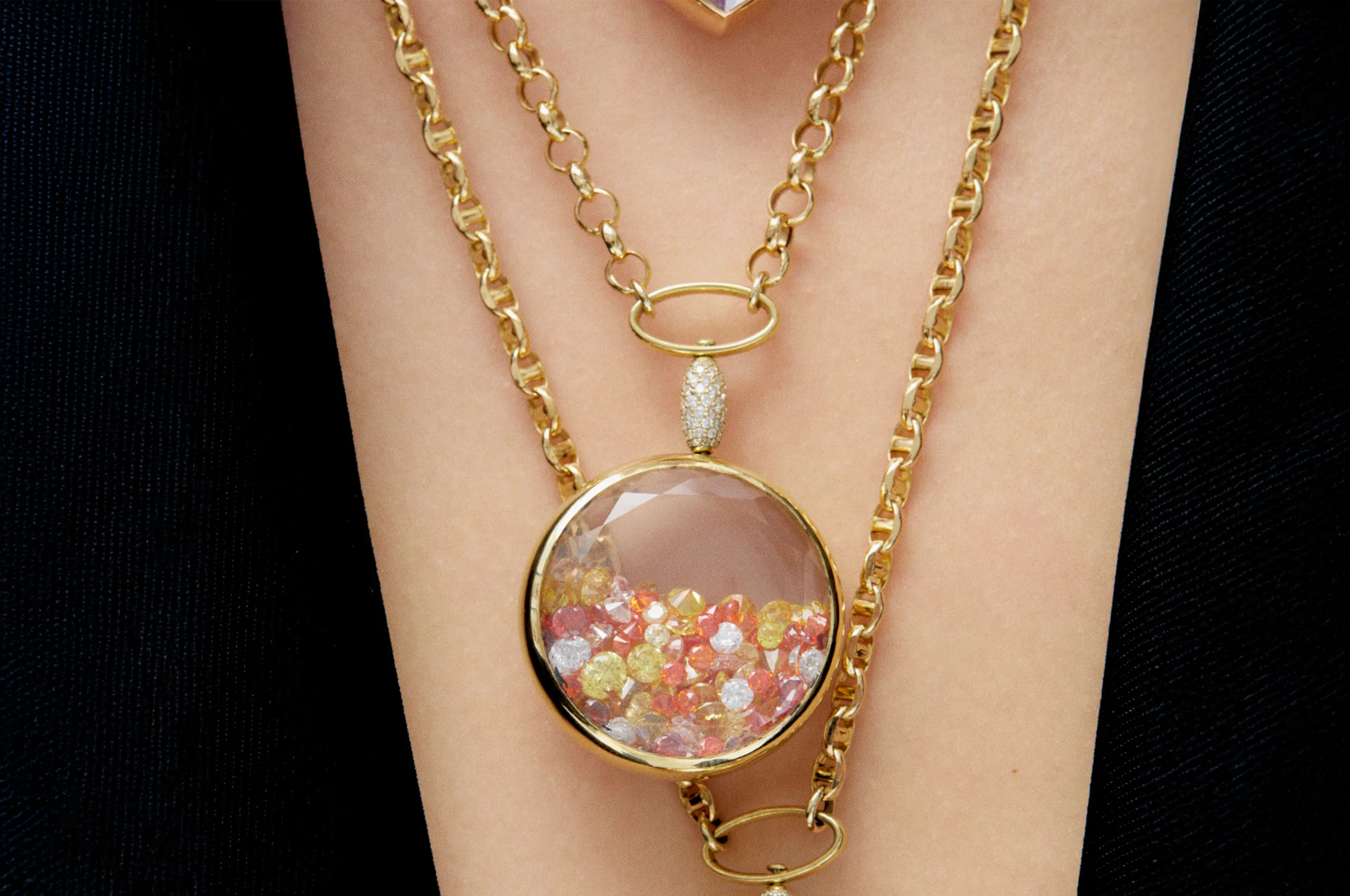 Aponine Round Medallion from the Sparks collection crafted in white quartz and 18k yellow gold, filled with diamonds and the brand's 'sunshine crystal mix' totalling 28.62 carats
