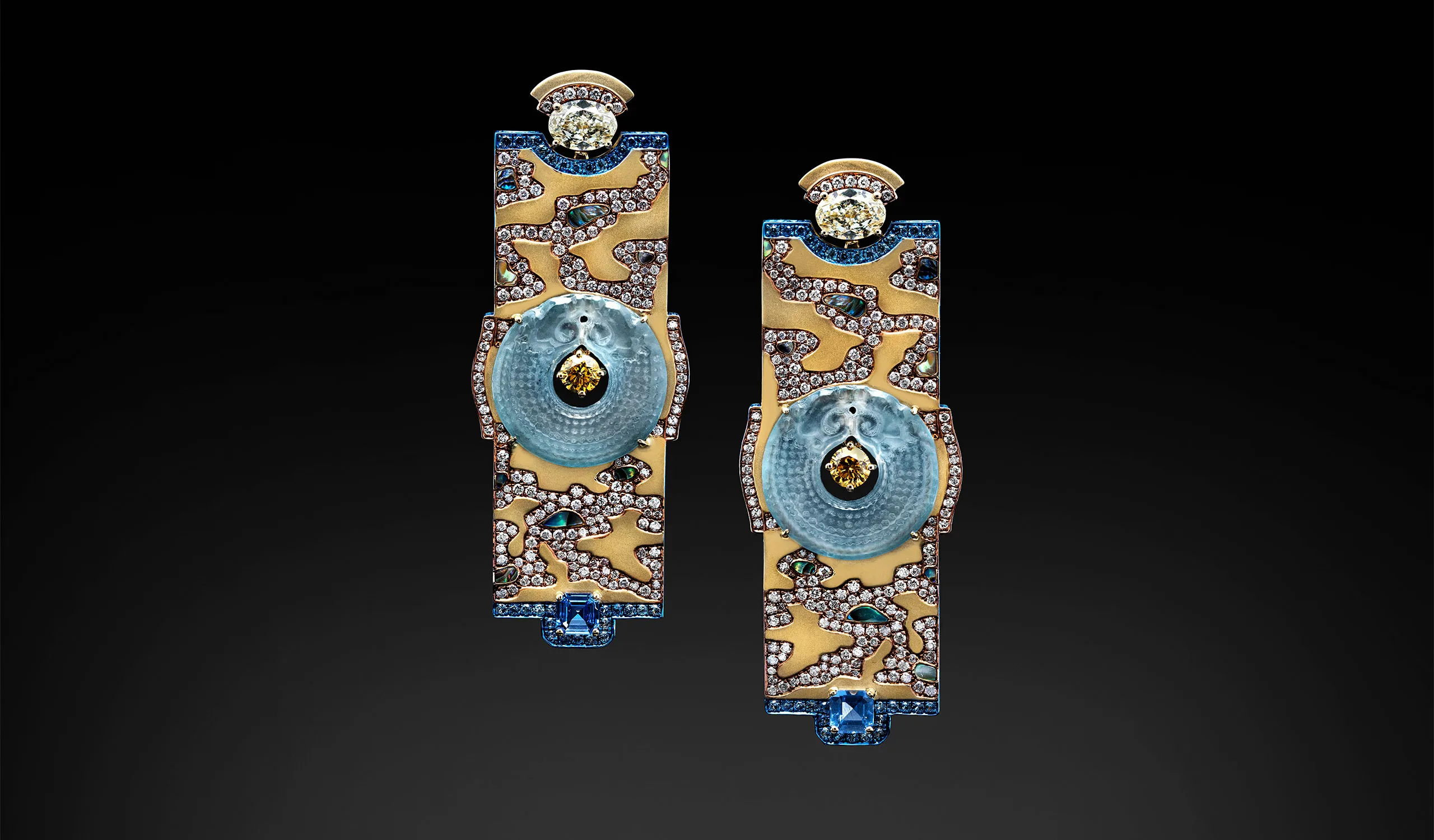 Austy Lee The Dragon in the River earrings from The Jade Dynasty collection with Burmese greyish blue jades, fancy yellow diamonds, blue sapphires, abalone shells, and champagne diamonds set in 18k yellow gold 