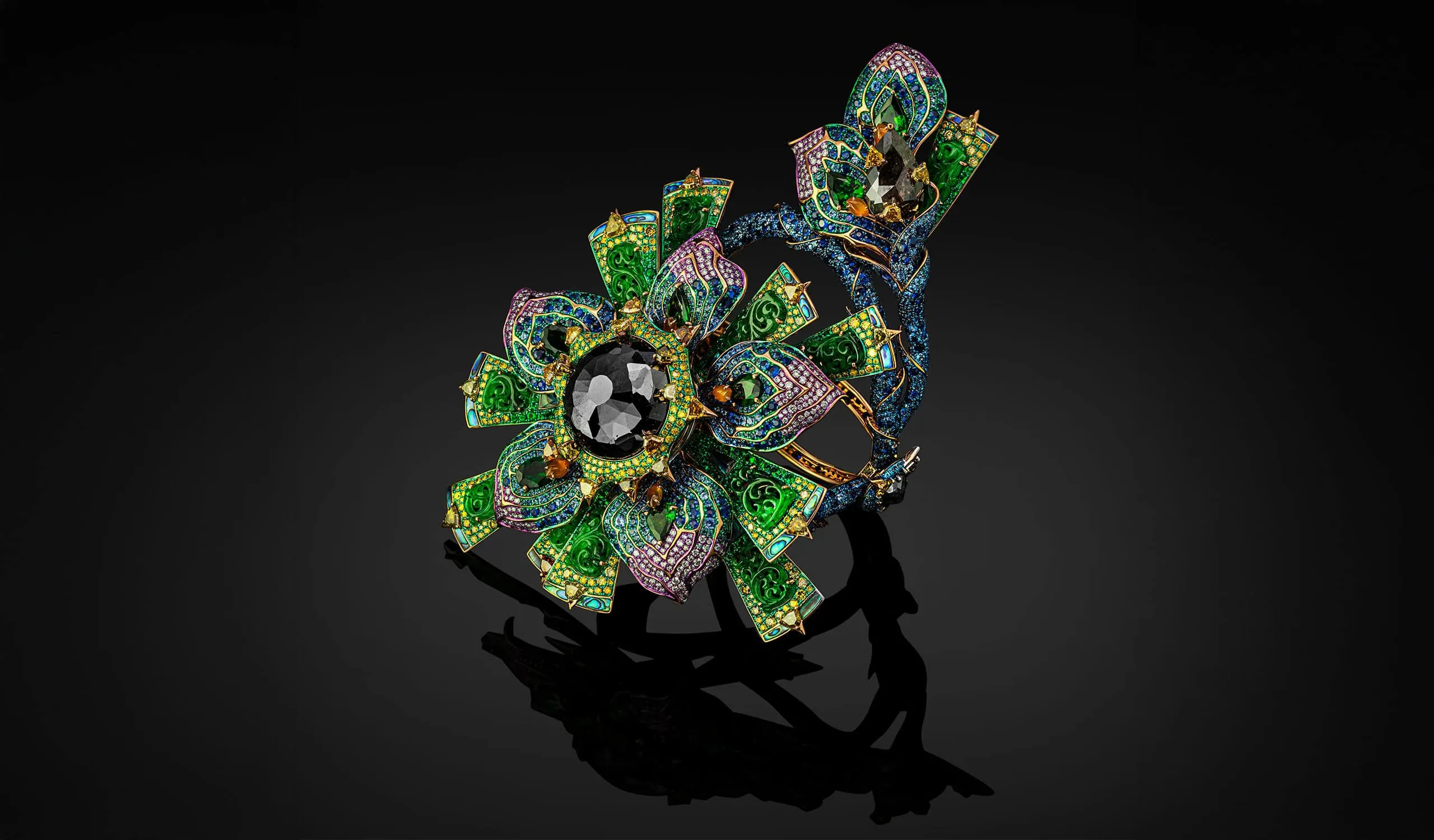 Austy Lee The Kunlun Zinnia bangle from The Psychedlic Light Collection with Burmese green and orange jades, tsavorites, abalone shells, blue sapphire, emeralds, and diamonds