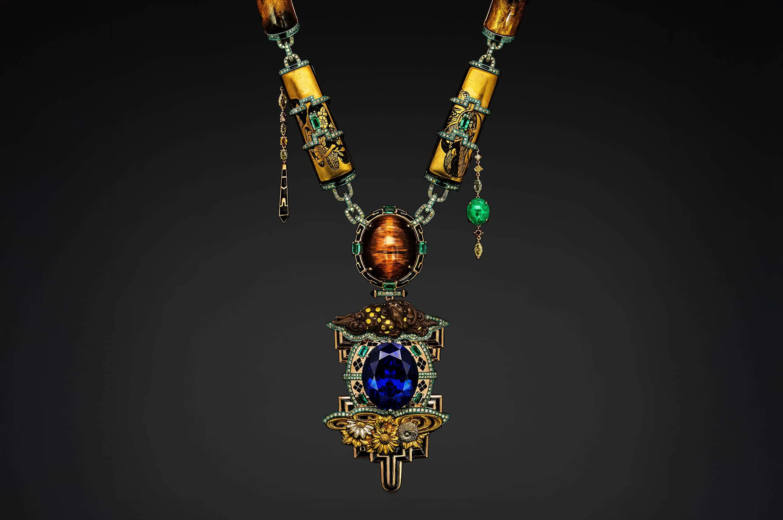 Austy Lee The Meiji' Gold necklace from The Ancient Fetus Collection with antique Shakudō Netsuke, antique Japanese lacquerware, golden corals, tanzanite, Colombian emerald, Zambian emeralds, cat’s eye rutile, and diamonds 