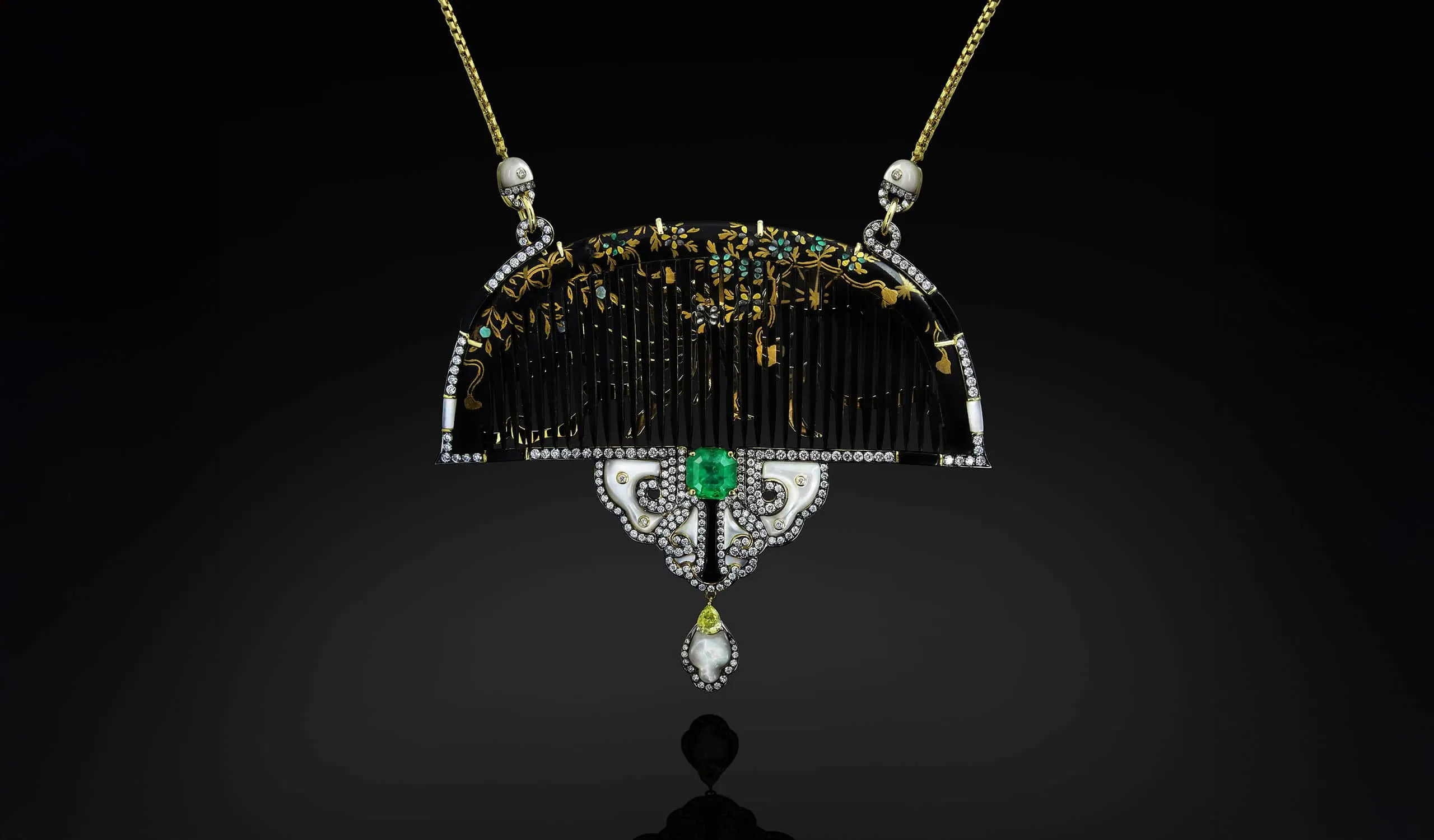 Austy Lee The Meiji's Chic necklace from The Ancient Fetus Collection with antique lacquered Tsuge combs, Colombian emerald, mother of pearl, onyx, and diamonds