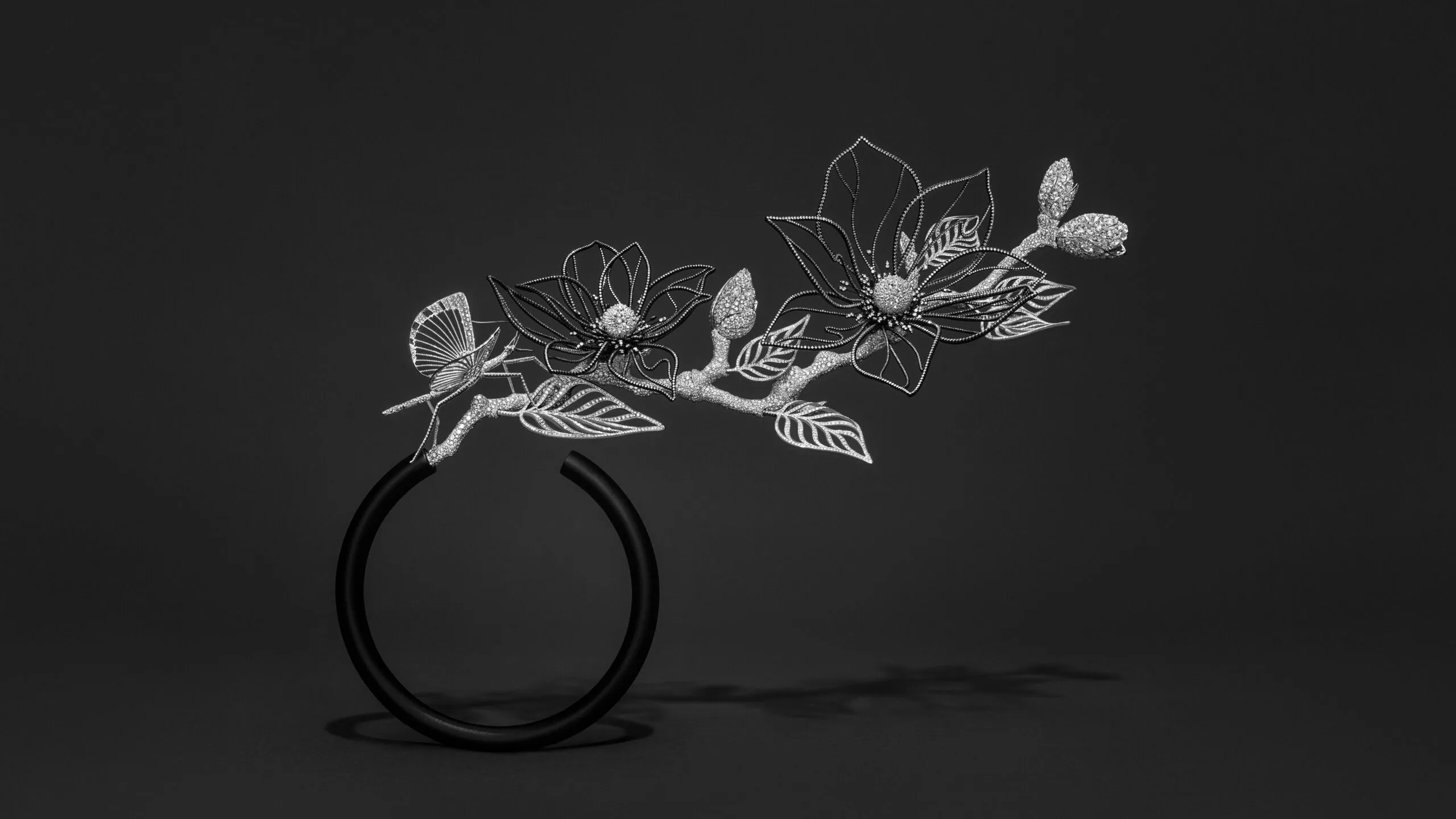 Composition No.2 of the Boucheron Impermanence High Jewellery collection, incorporating the Magnolia transformable head jewel-collar necklace and the Stick Insect brooch in a matte-black composite vase