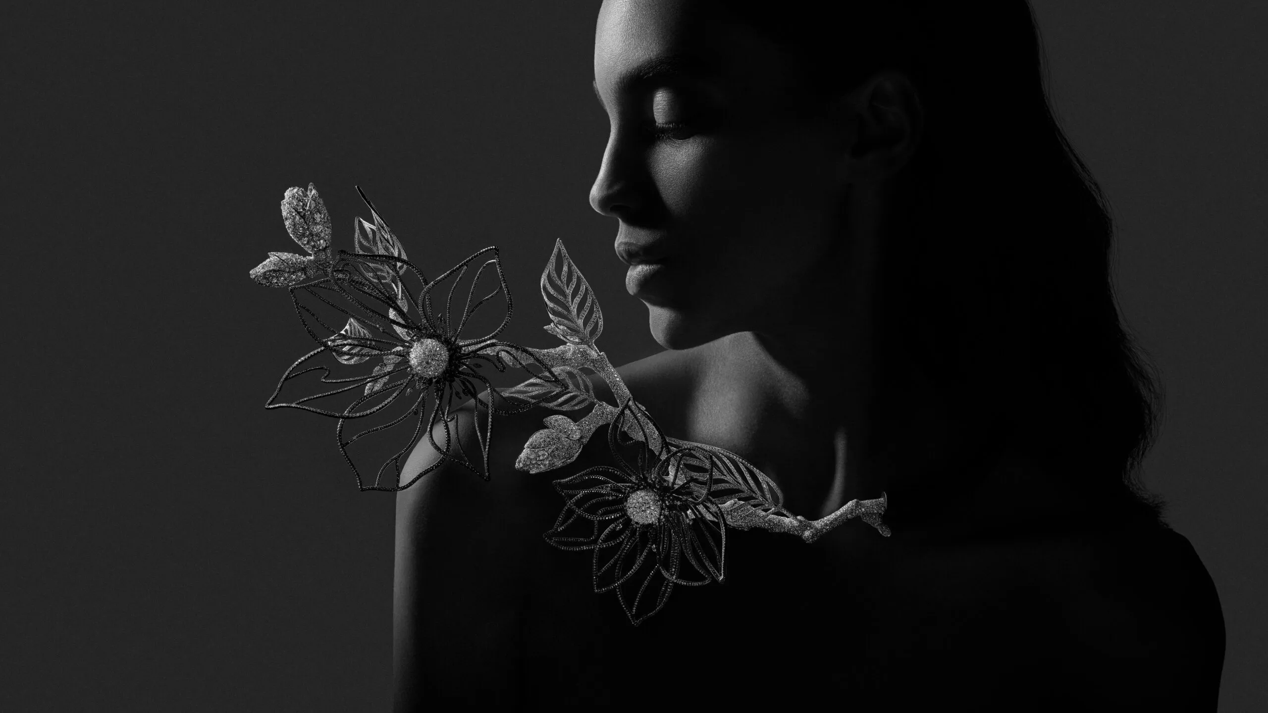 Magnolia transformable head jewel-collar necklace from Composition No.2 of the Boucheron Impermanence High Jewellery collection, crafted in black anodised aluminium, snow-set diamonds, white gold, inverse-set diamonds, black rhodium, black ceramic, rose-cut diamonds and brilliant-cut diamonds 