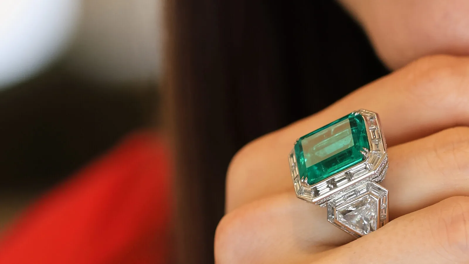 Katerina Perez wears the B.P. de Silva Drama Deco emerald ring with an 11.99-carat Colombian emerald and 10.65 carats of shield, baguette and round brilliant-cut diamonds, set in platinum