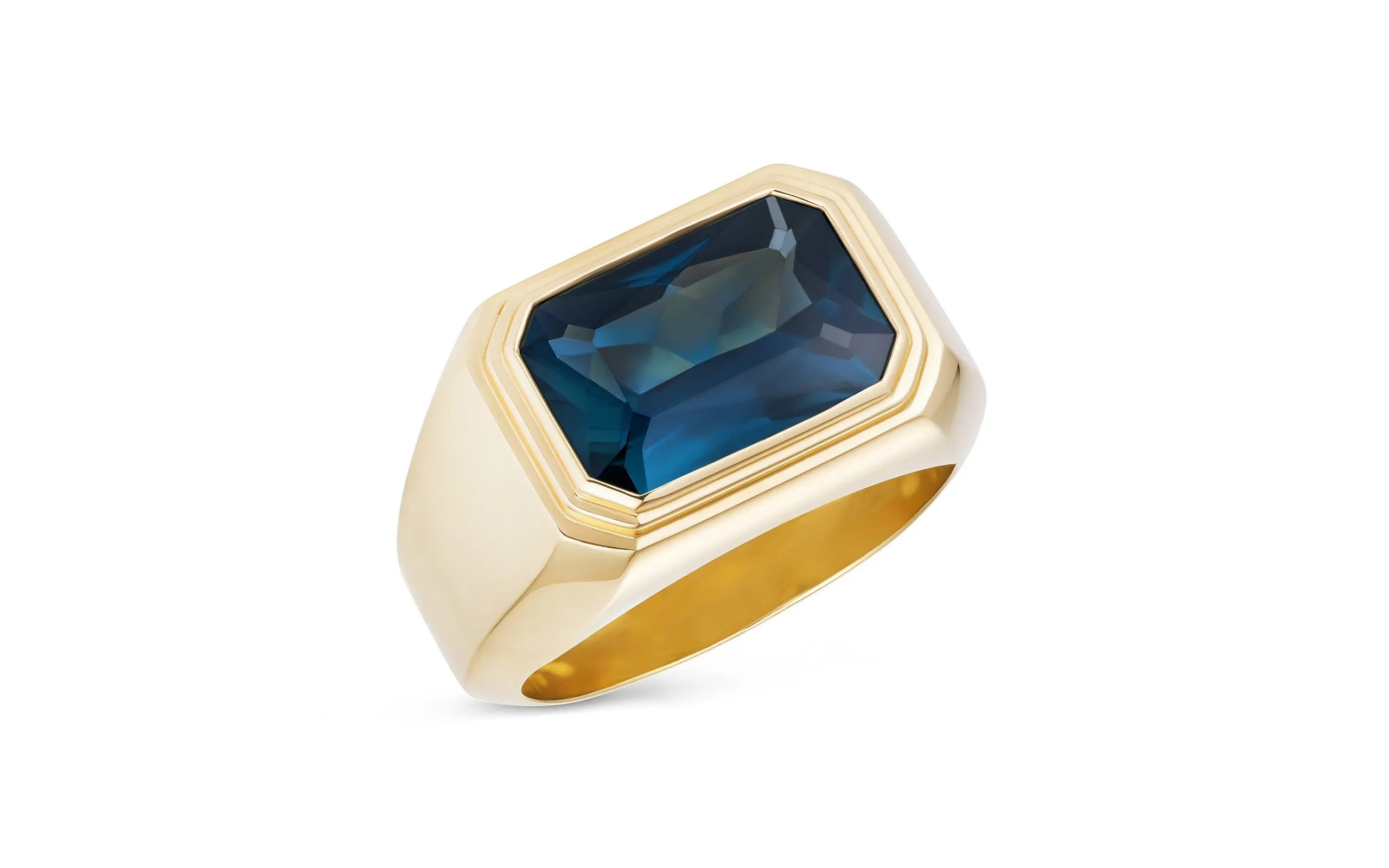 Bear Brooksbank The Solitaire IV ring, set with a 3.50 carat emerald cut teal sapphire in 18K yellow gold